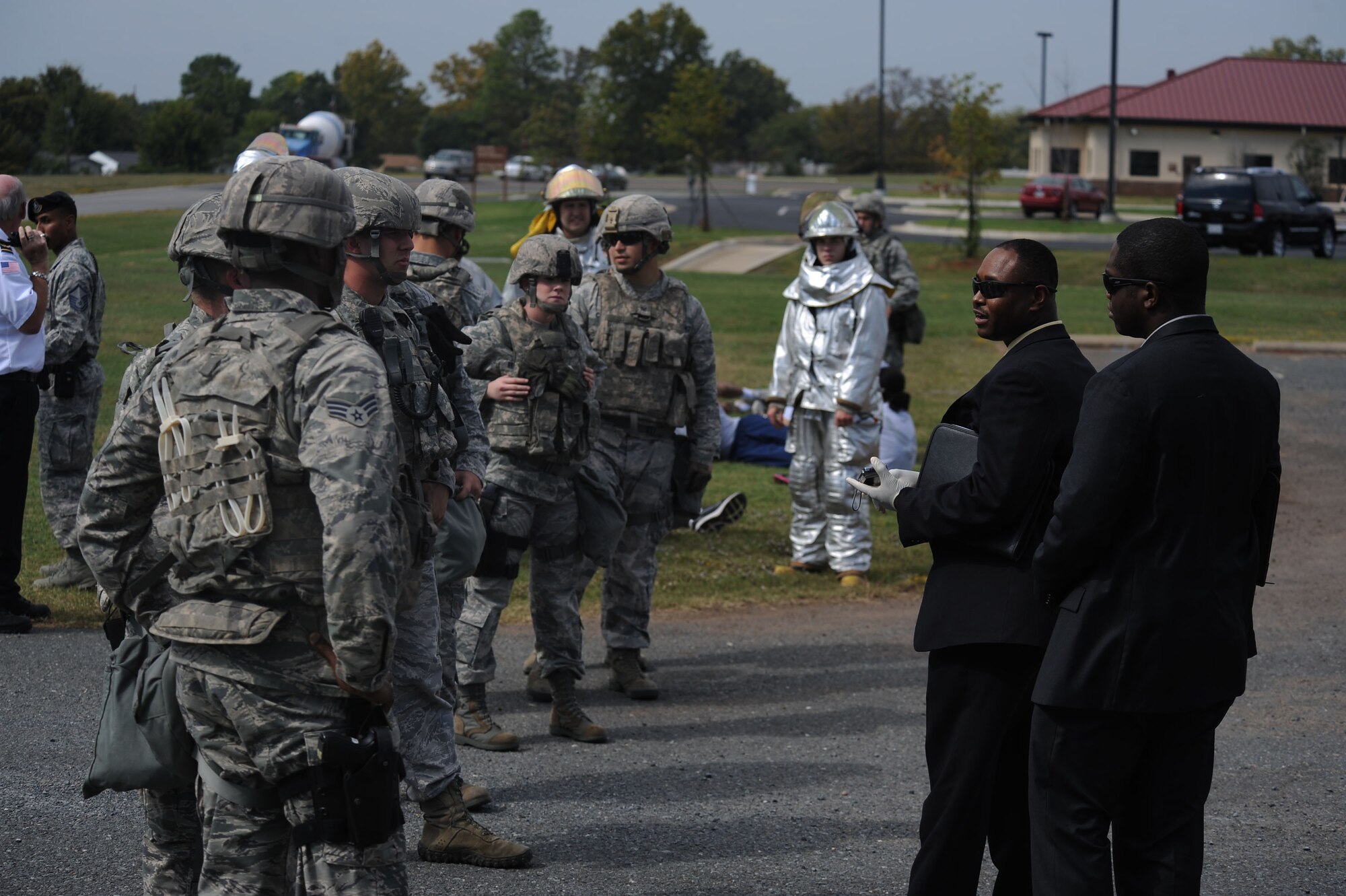 Agents from the Air Force Office of Special Investigation Detachment 219 brief Airmen from the 2nd Security Forces Squadron after a simulated vehicle attack during a major accident response exercise on Barksdale Air Force Base, La., Oct. 12. After the briefing, the Airmen and agents searched the area for evidence and suspicious material. (U.S. Air Force photo/ Senior Airman Micaiah Anthony)(RELEASED) 