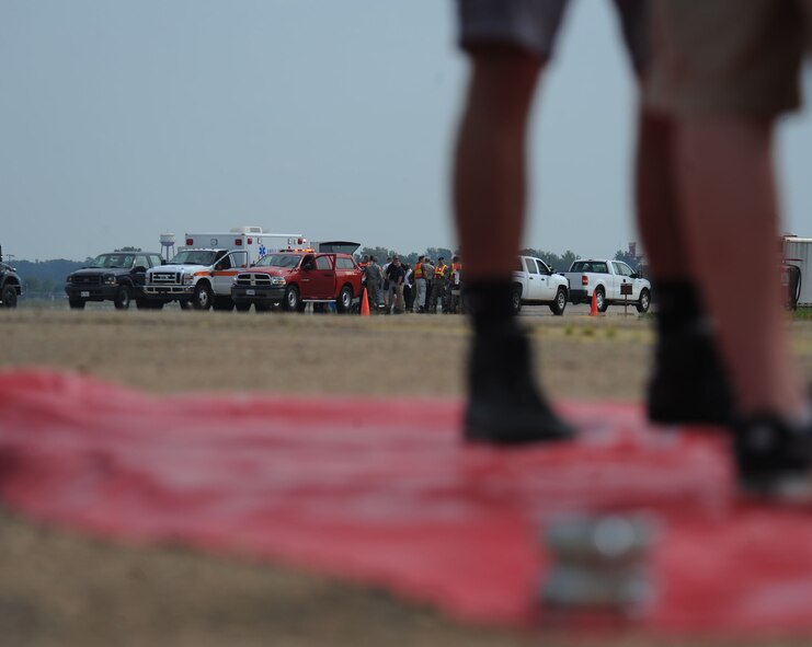 Airmen exposed to a simulated hazardous substance wait in a quarantined area as emergency response personnel assess the situation during a major accident response exercise on Barksdale Air Force Base, La., Oct. 12. Firefighters, security forces, emergency management, bioenvironmental and medical Airmen and civilians worked together to assist the Airmen and reduce the spread of the hazardous substance. (U.S. Air Force photo/ Senior Airman Micaiah Anthony)(RELEASED)
