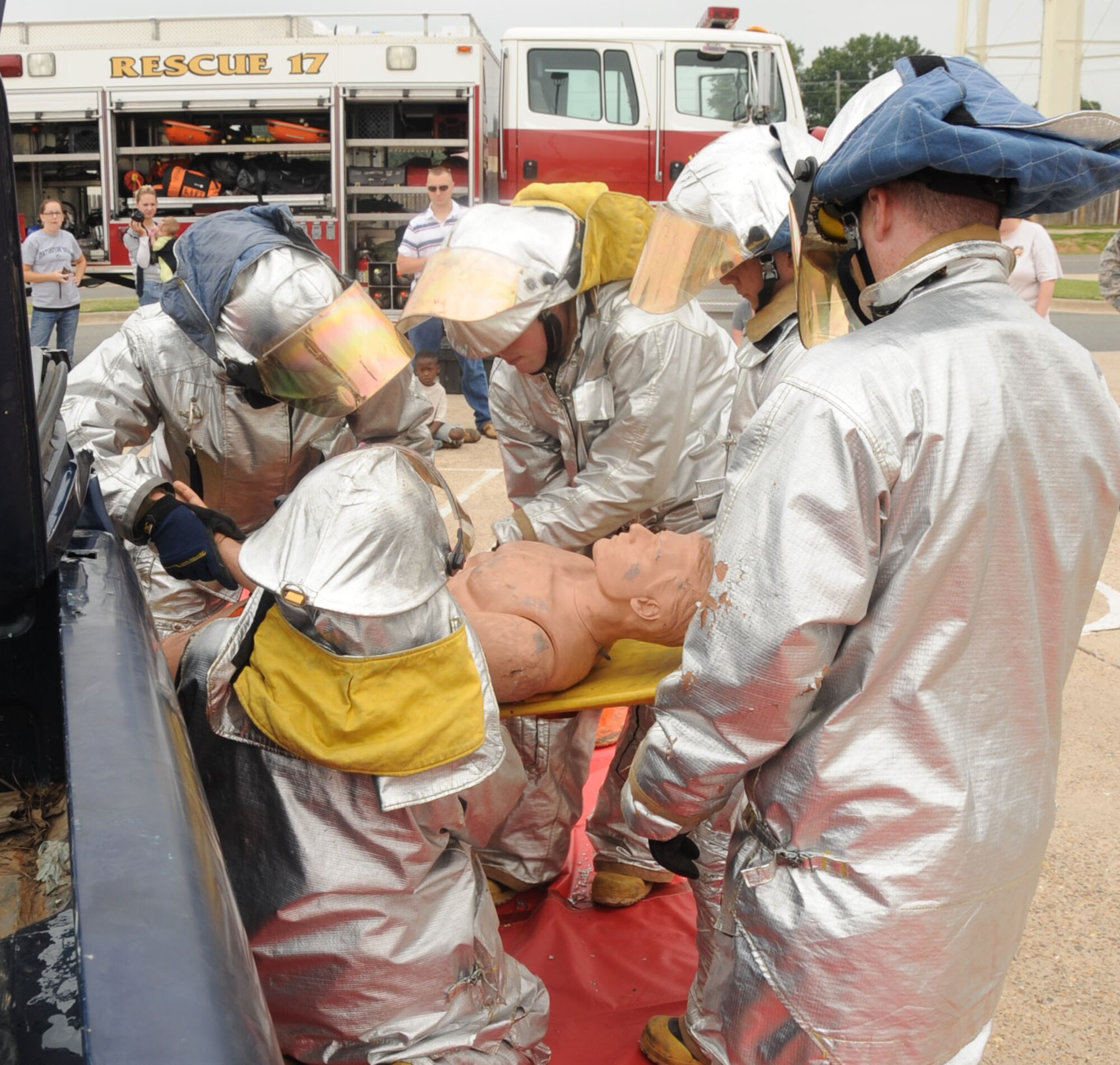 Firefighters from the 2nd Civil Engineer Squadron remove a crash dummy during a vehicle extrication demonstration as part of Fire Prevention Week on Barksdale Air Force Base, La., Oct. 13. The purpose of Fire Prevention Week is to inform the Barksdale Community on fire safety and useful fire prevention tips. (U.S. Air Force photo/Senior Airman Sean Martin)(RELEASED)