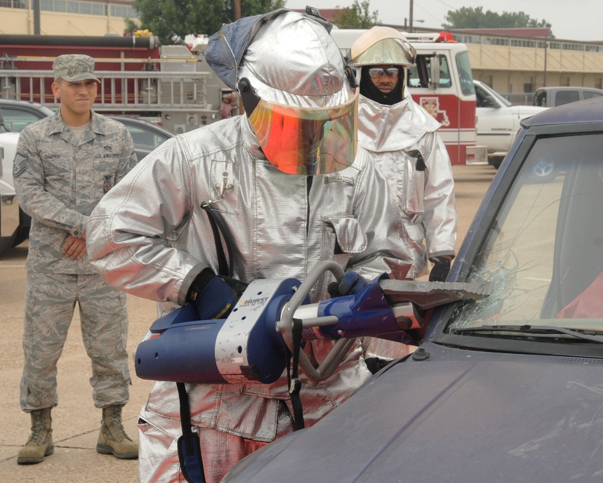 A firefighter from the 2nd Civil Engineer Squadron uses the Hurst jaws-of-life during a vehicle extrication demonstration as part of Fire Prevention Week on Barksdale Air Force Base, La., Oct. 13. The purpose of Fire Prevention Week is to inform the Barksdale Community on fire safety and useful fire prevention tips. (U.S. Air Force photo/Senior Airman Sean Martin)(RELEASED)