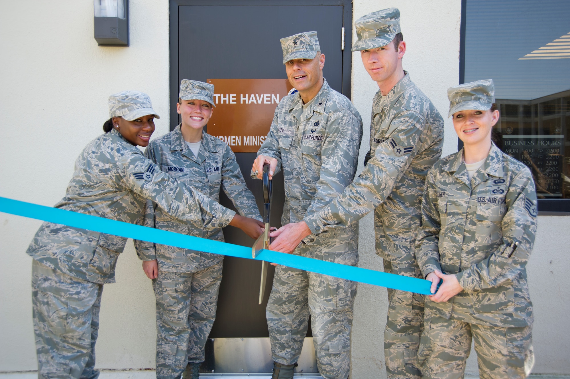 Senior Airman Tiffany Blake, 81st Medical Operations Squadron; Airman 1st Class Ashley Morgan, 81st Dental Squadron; Brig. Gen. Brad Spacy, 81st Training Wing commander; Airman 1st Class Bryan White, 81st Inpatient Operation Squadron and Staff Sgt. Tawny Crutcher, 81st TRW chapel assistant, cuts the ribbon during a ceremony opening the Haven in building 4908 Oct. 12, 2012, at Keesler Air Force Base, Miss.  (U.S. Air Force photo by Adam Bond)