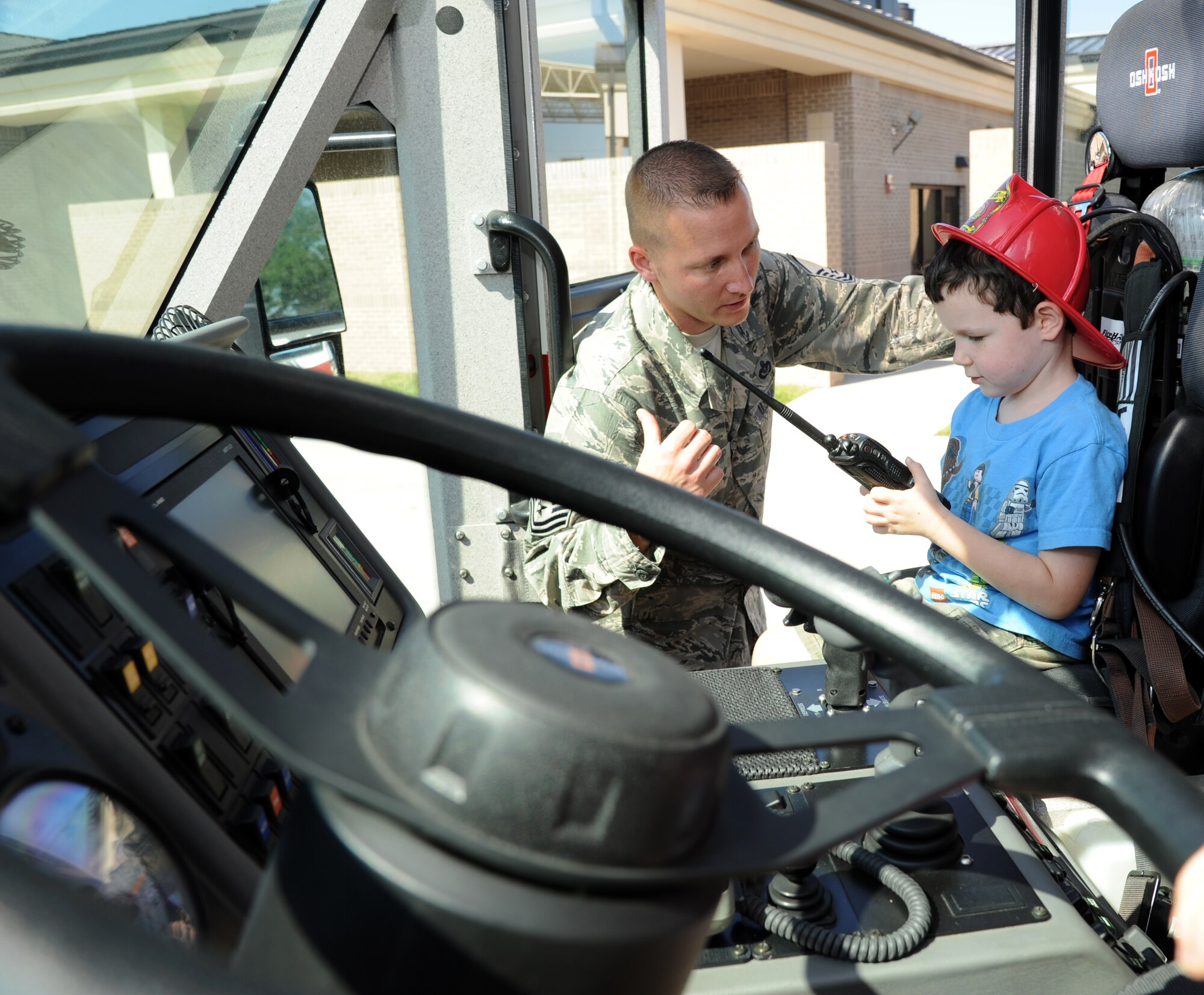 Daniyel Blankenship, Keesler firefighter, provides a tour of a fire truck to Keaton Tottle, 5, son of April and Tech. Sgt. Ken Tottle, 335th Training Squadron, during the Keesler Fire Department’s open house Oct. 13, 2012, Keesler Air Force Base, Miss.  The event was held on the final day of fire prevention week during which the fire department conducted random fire drills throughout the base, toured various facilities with Sparky the Fire Dog, passed out fire safety handouts and fire hats for children and provided stove and fire extinguisher demonstrations.  A.J.’s mother, Lt. Col. Carolyn Pignataro, 81st Medical Group, is currently deployed to Afghanistan.  (U.S. Air Force photo by Kemberly Groue)