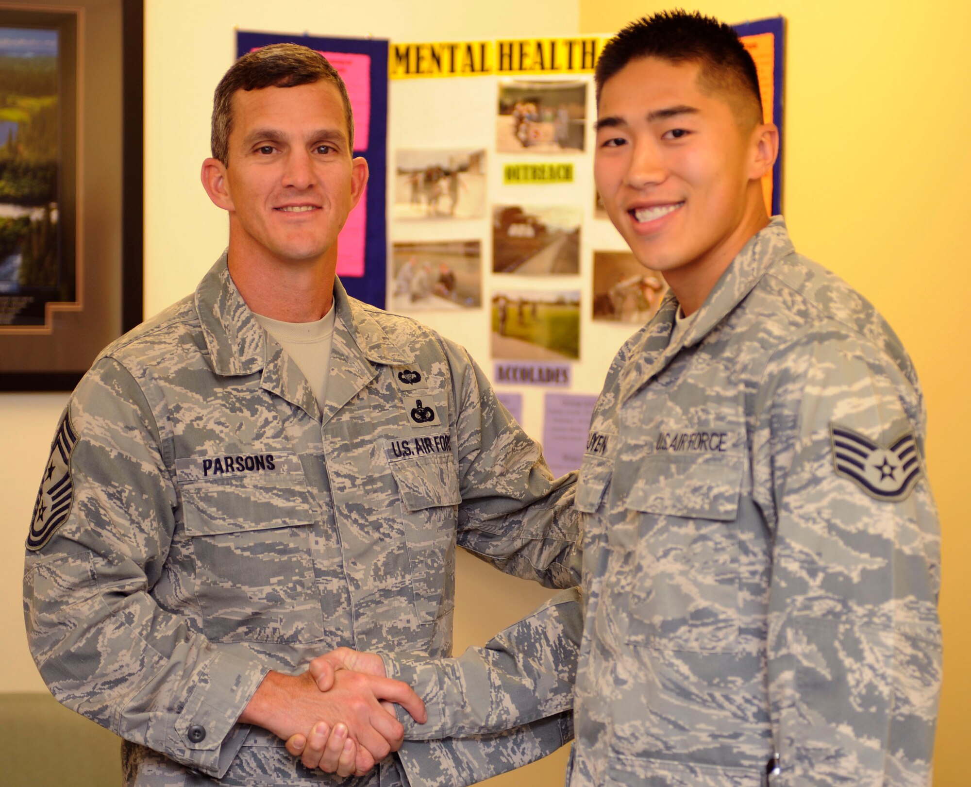U.S. Air Force Chief Master Sgt. Richard Parsons, Command Chief of Air Combat Command, coins Staff Sgt. Davis Nguyen, 366th Medical Group mental health technician, Oct. 10, 2012, at Mountain Home Air Force Base, Idaho. Nguyen received this special recognition due to his outreach efforts to de-stigmatize mental health and encourage early help-seeking. (U.S. Air Force photo/Airman 1st Class Shane M. Phipps)


