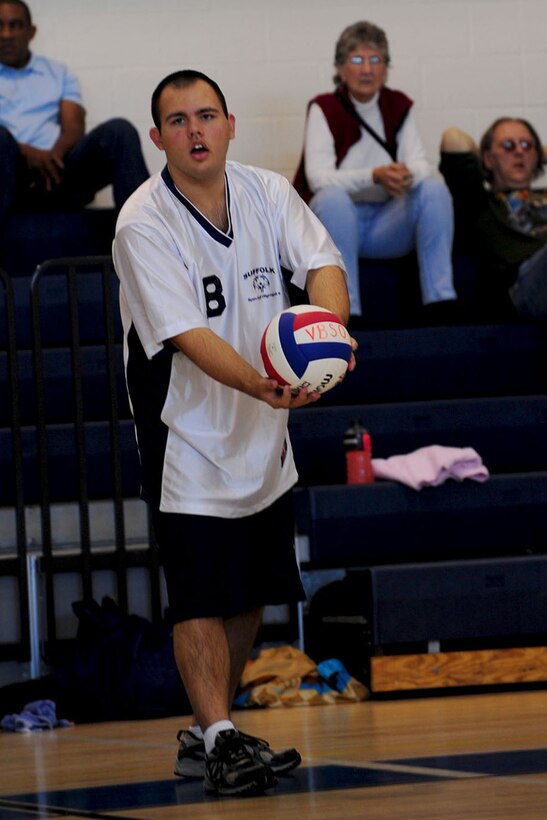 Ethan Smith, with Suffolk Area 29, prepares to serve the ball during the volleyball portion of the Special Olympics at the Shellbank Fitness Center at Langley Air Force Base, Va., Oct. 13, 2012. The local athletes of the Tidewater Region compete for the state title to eventually become part of more than 4 million competitors in the World Special Olympics. (U.S. Air Force photo by Staff Sgt Ashley Hawkins/Released)