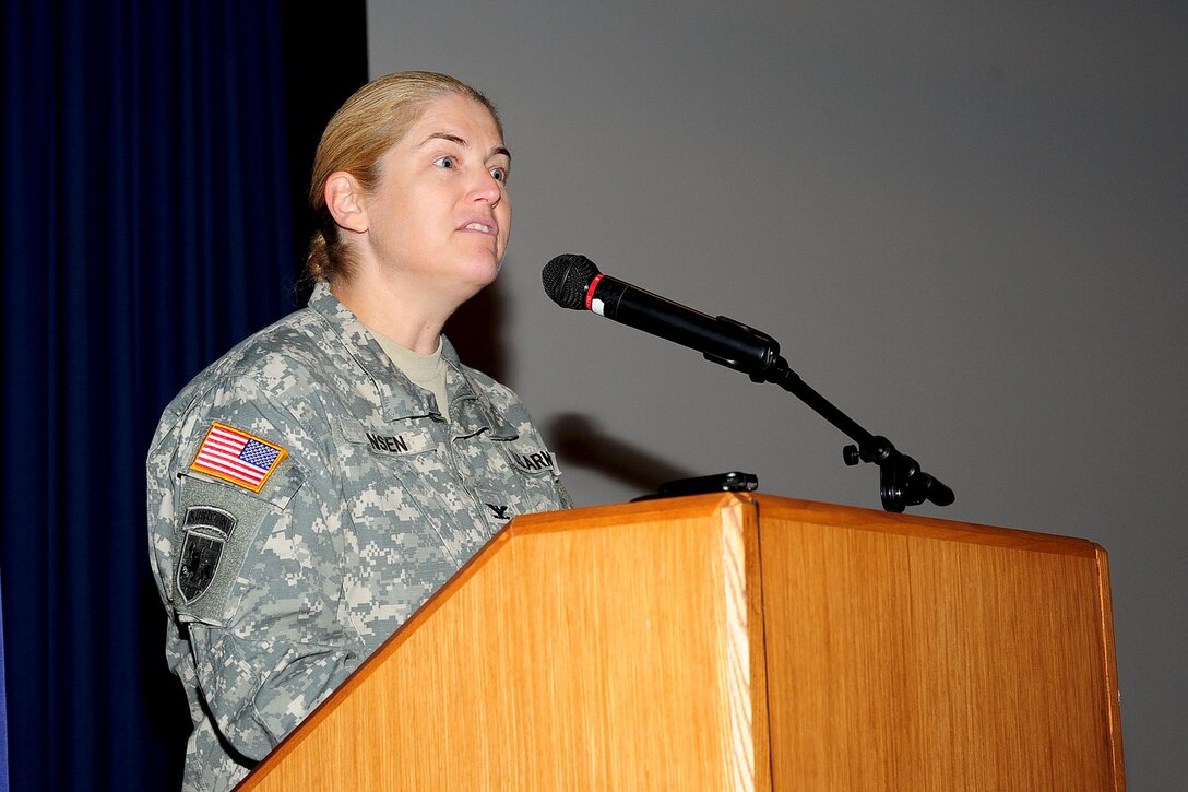 U.S. Army Col. Jayne V. Jansen, 633rd Air Base Wing vice commander, addresses the crowd during the Special Olympics opening ceremony at the base theater at Langley Air Force Base, Va., Oct. 13, 2012. Every year, Langley AFB hosts the October event for the local teams to qualify for the state games. (U.S. Air Force photo by Staff Sgt Ashley Hawkins/Released)