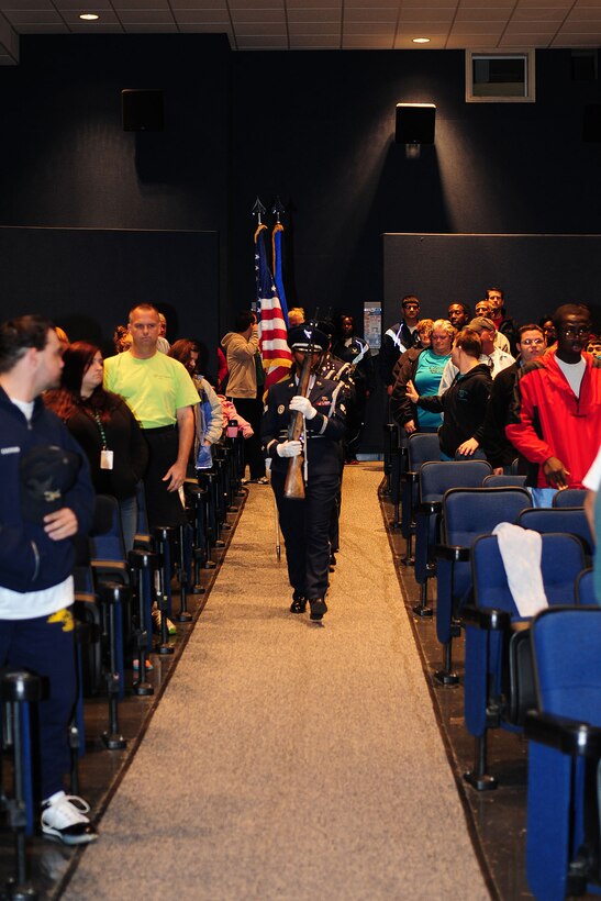 The base Honor Guard posts the colors during the Special Olympics opening ceremony at the theater at Langley Air Force Base, Va., Oct. 13, 2012. Langley AFB hosted the 12th annual Special Olympics, which had more than 400 athletes participating in soccer, bowling and volleyball. (U.S. Air Force photo by Staff Sgt Ashley Hawkins/Released)