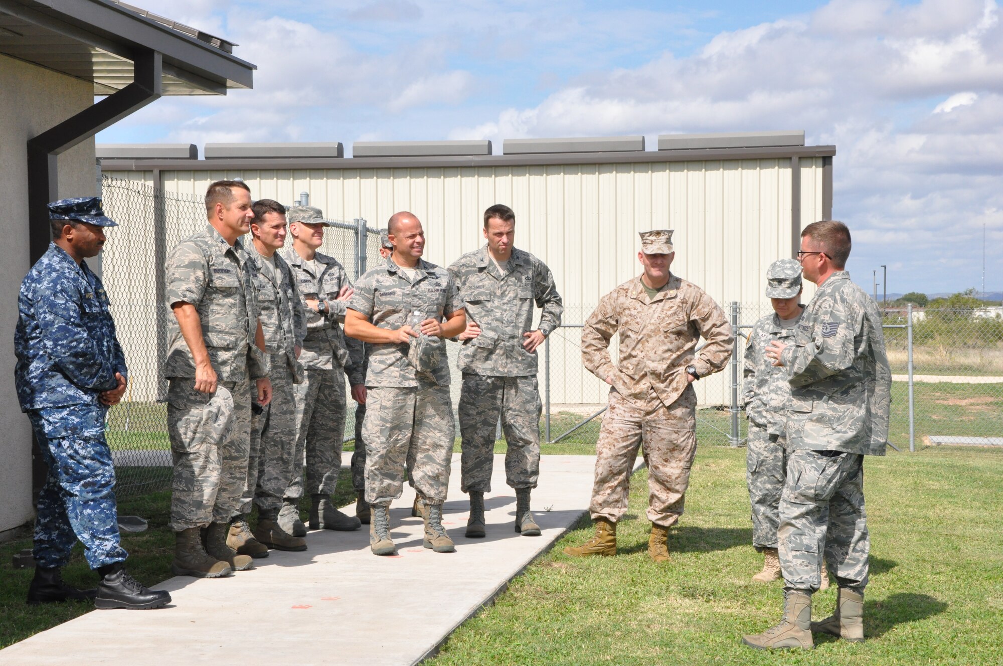 GOODFELLOW AIR FORCE BASE, Texas- Commanders and chiefs from the base gather for the Combined Federal Campaign finale Oct. 12, here. The base leaders volunteered to help out with the finale by dressing in protective wear and allowing, under a controlled environment, the Security Forces K-9 unit’s dogs to attack and take down them while attendees made contributions to the CFC. (U.S. Air Force photo/ Airman 1st Class Erica Rodriguez)