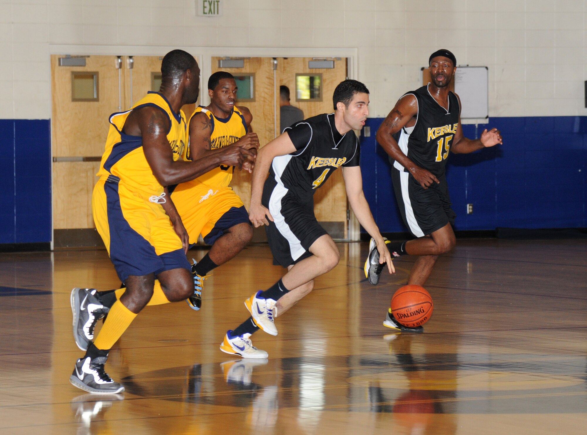 Alexander Nelson and Julius Moses, Maxwell-Gunter, plays defense as Jimmy Pajuheshfar, Keesler, pushes the ball down the court as his team-mate, Alvin Holmes, stays close to assist during the men’s varsity basketball game Oct. 13, 2012, at the Blake Fitness Center, Keesler Air Force Base.  Maxwell-Gunter defeated Keesler, 74-68.  The Keesler women’s varsity team played an exhibition game against the Mississippi Lady Storms.  Keesler defeated the Lady Storms 55-37.  (U.S. Air Force photo by Kemberly Groue)