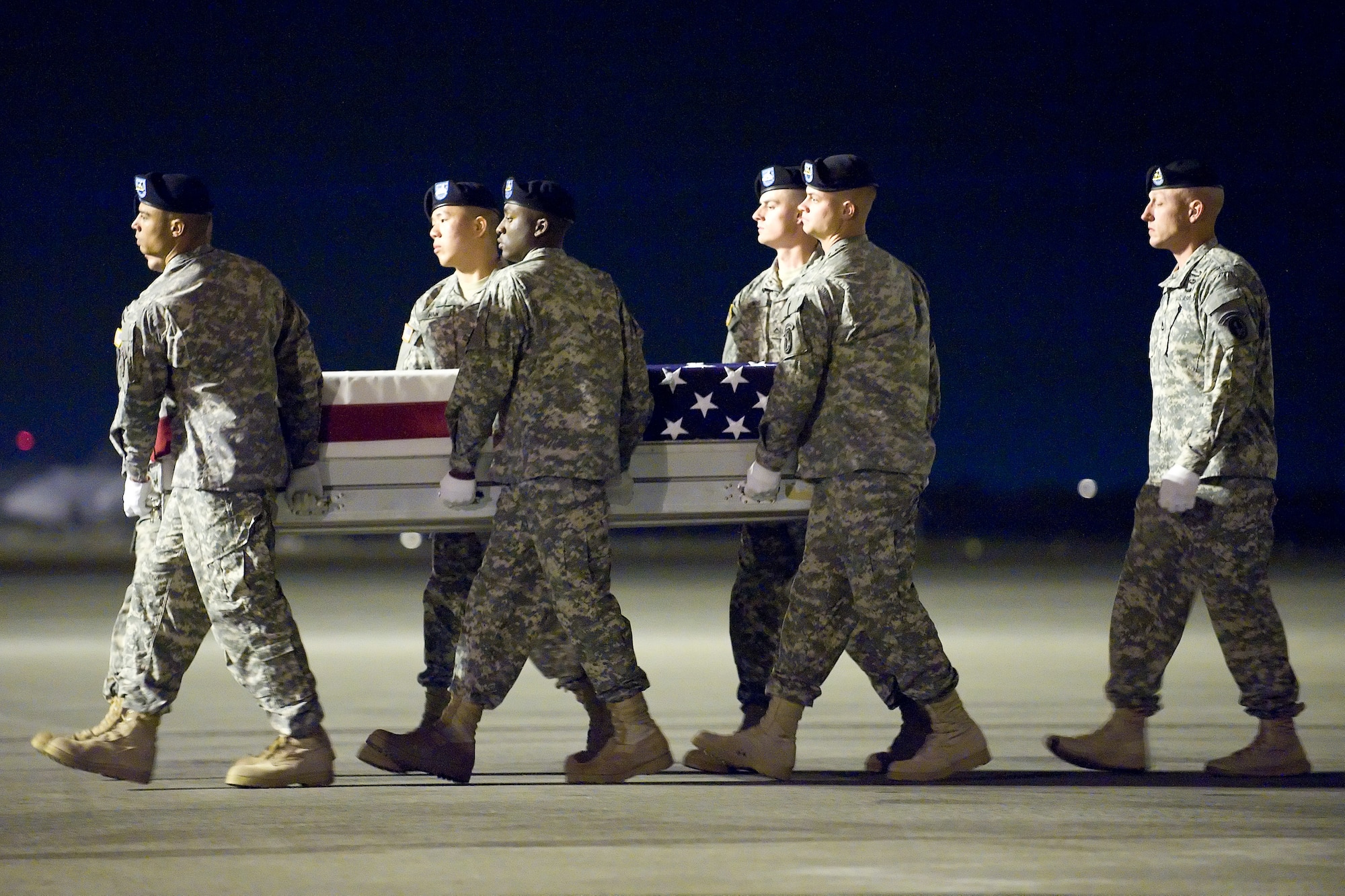 A U.S. Army carry team transfers the remains of Army Spc. Brittany B. Gordon of St. Petersburg, Fla., at Dover Air Force Base, Del., Oct. 15, 2012.  Gordon was assigned to the 572 Military Intelligence Company, 2nd Stryker Brigade Combat Team, 2nd Infantry Division, Joint Base Lewis-McChord, Wash.  (U.S. Air Force photo/Adrian R. Rowan)