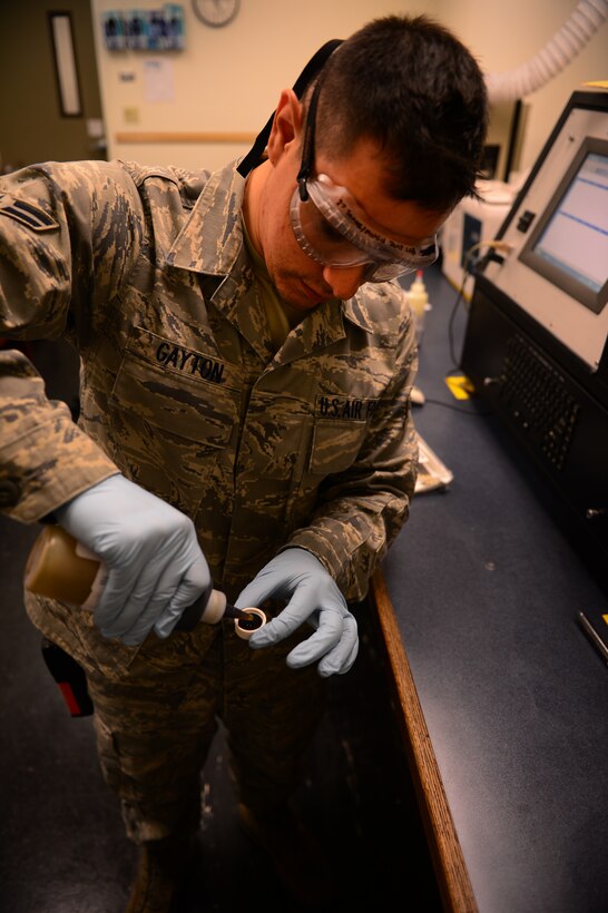 U.S. Air Force Airman 1st Class Kyle Gayton, 27th Special Operations Maintenance Squadron nondestructive inspection laboratory specialist, performs an oil analysis in the NDI laboratory at Cannon Air Force Base, N.M., Sept. 6, 2012. The 27 SOMXS NDI laboratory specialists have a mission to provide optimum support to the structural maintenance program through various inspections and analysis without causing damage. (U.S. Air Force photo/Airman 1st Class Eboni Reece)