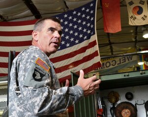 U.S. Army Brig. Gen. Jeffrey N. Colt, 18th Airborne Corps deputy commanding general, speaks to Soldiers from the 544th Dive Detachment, Special Troops Battalion, 7th Sustainment Brigade, Oct 3. Colt also toured the Atlas forklift, Kalmar, and watercraft simulation centers on base, and met with watercraft Soldiers while visiting 3rd Port. (U.S. Army photo by Sgt. Edwin Junior Rodriguez / Released)