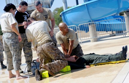 The emergency medical team from Joint Base San Antonio-Fort Sam
Houston rescues a dummy as part of the water extraction challenge
during the Emergency Medical Technician Rodeo at Cannon Air Force
Base, N.M., Sept. 21. The EMT Rodeo is a competition in which teams from across the United States and Germany test their skills in various events that simulate real-life scenarios.
Photo by Airman 1st Class Xavier Lockley