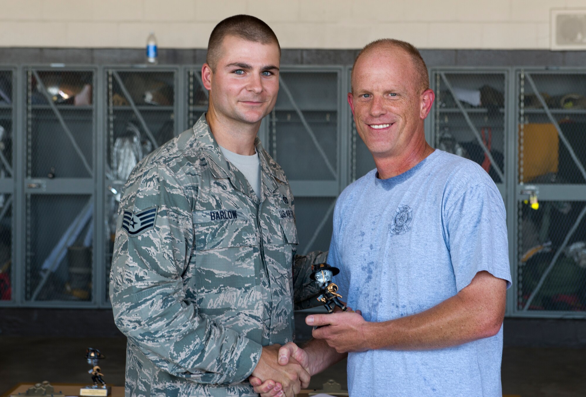 U.S. Air Force Chief Frank Batten, 23d Wing command chief, receives a first place trophy during a fire muster challenge at Moody Air Force Base, Ga., Oct. 12, 2012. Batten received the trophy for completing the Commander/Chief’s challenge with a final time of one minute, two seconds. (U.S. Air Force photo by Senior Airman Douglas Ellis/Released)
