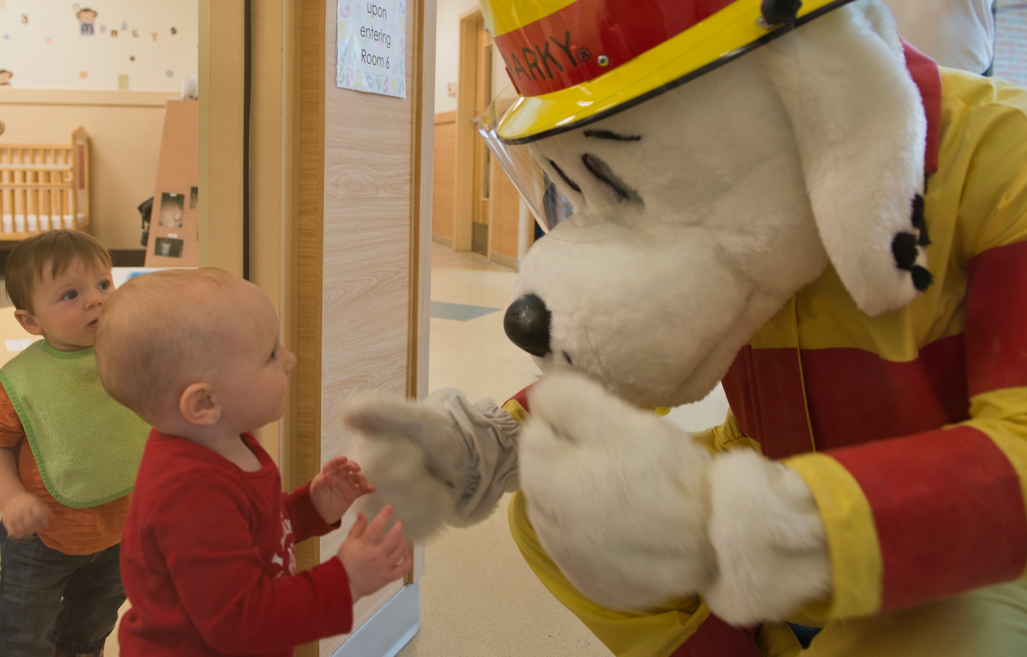 Sparky the Fire Dog visits children during fire prevention week at the Child Development Center at Moody Air Force Base Ga., Oct. 10, 2012. During the week, the Moody Fire Department raised fire prevention awareness throughout Moody and the local community. (U.S. Air Force photo by Senior Airman Douglas Ellis/Released)
