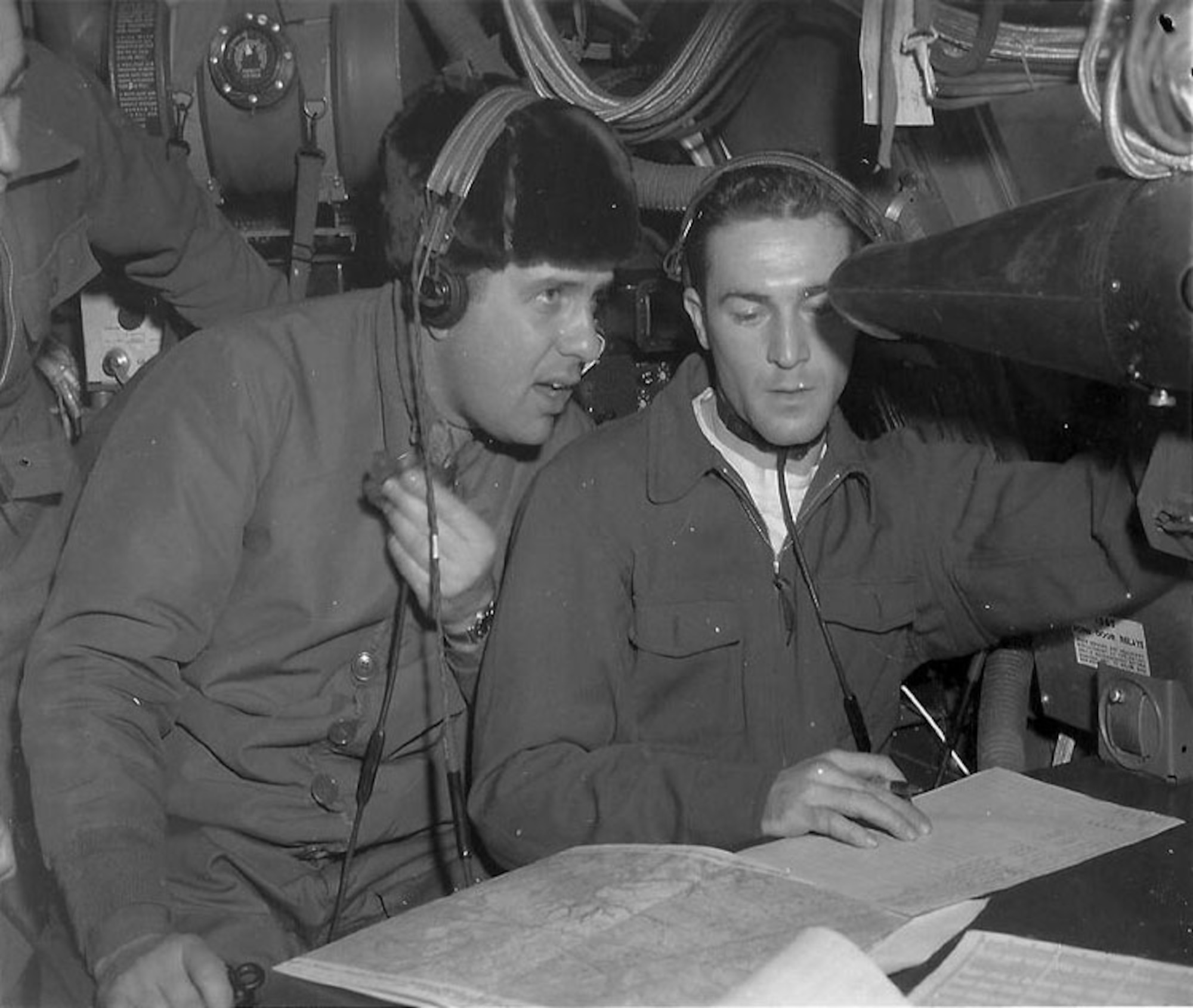 Then-Maj. Maynard E. White, commander of the 46th Reconnaissance Squadron, and Lt. "Whit" Williams, crew navigator, at the radar scope at the precise moment their aircraft flew over the North Pole on Oct. 16, 1946. (Photo courtesy of Ken White)
