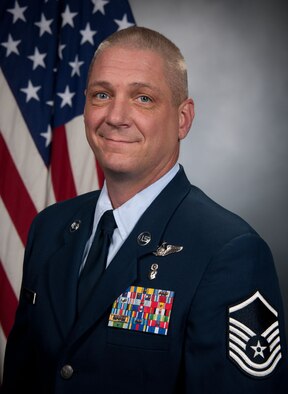 Master Sgt. Shannon McBee poses for his official photo after being nominated for the 2013 Noncommissioned Officer Association Vanguard Award. McBee saved a man's life while on a flight from Atlanta to San Antonio. (Submitted photo) 