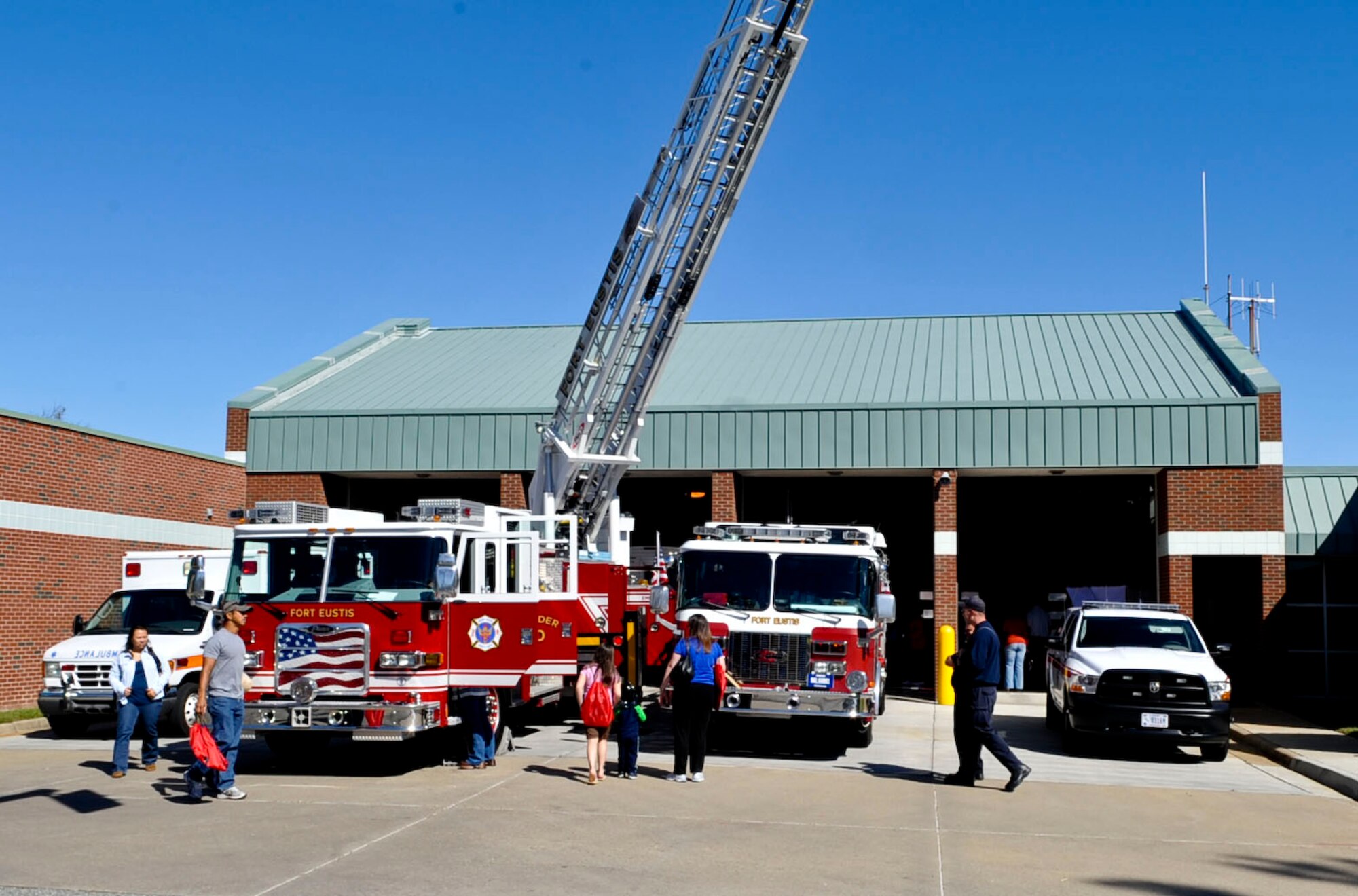 Residents of Fort Eustis, Va., attend the Fire Departments open house Oct. 13, 2012, as part of Fire Prevention Week. Visitors were able to climb in and on fire trucks and ambulances as well enjoy a variety of other events. (U.S. Air Force photo by Staff Sgt. Wesley Farnsworth / Released)