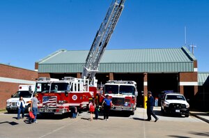 Residents of Fort Eustis, Va., attend the Fire Departments open house Oct. 13, 2012, as part of Fire Prevention Week. Visitors were able to climb in and on fire trucks and ambulances as well enjoy a variety of other events. (U.S. Air Force photo by Staff Sgt. Wesley Farnsworth / Released)
