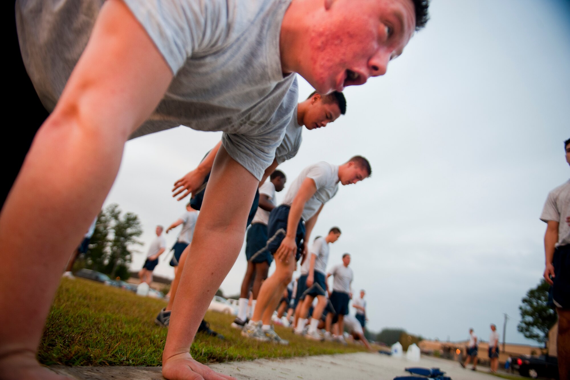 Members of the 823d base Defense Squadron complete burpees during the annual LeeBernard Chavis Memorial Workout Oct. 15, 2012, at Moody Air Force Base, Ga. All squadrons within the 820th Base Defense Group participated in the workout to honor Chavis. (U.S. Air Force photo by Staff Sgt. Jamal D. Sutter/Released)