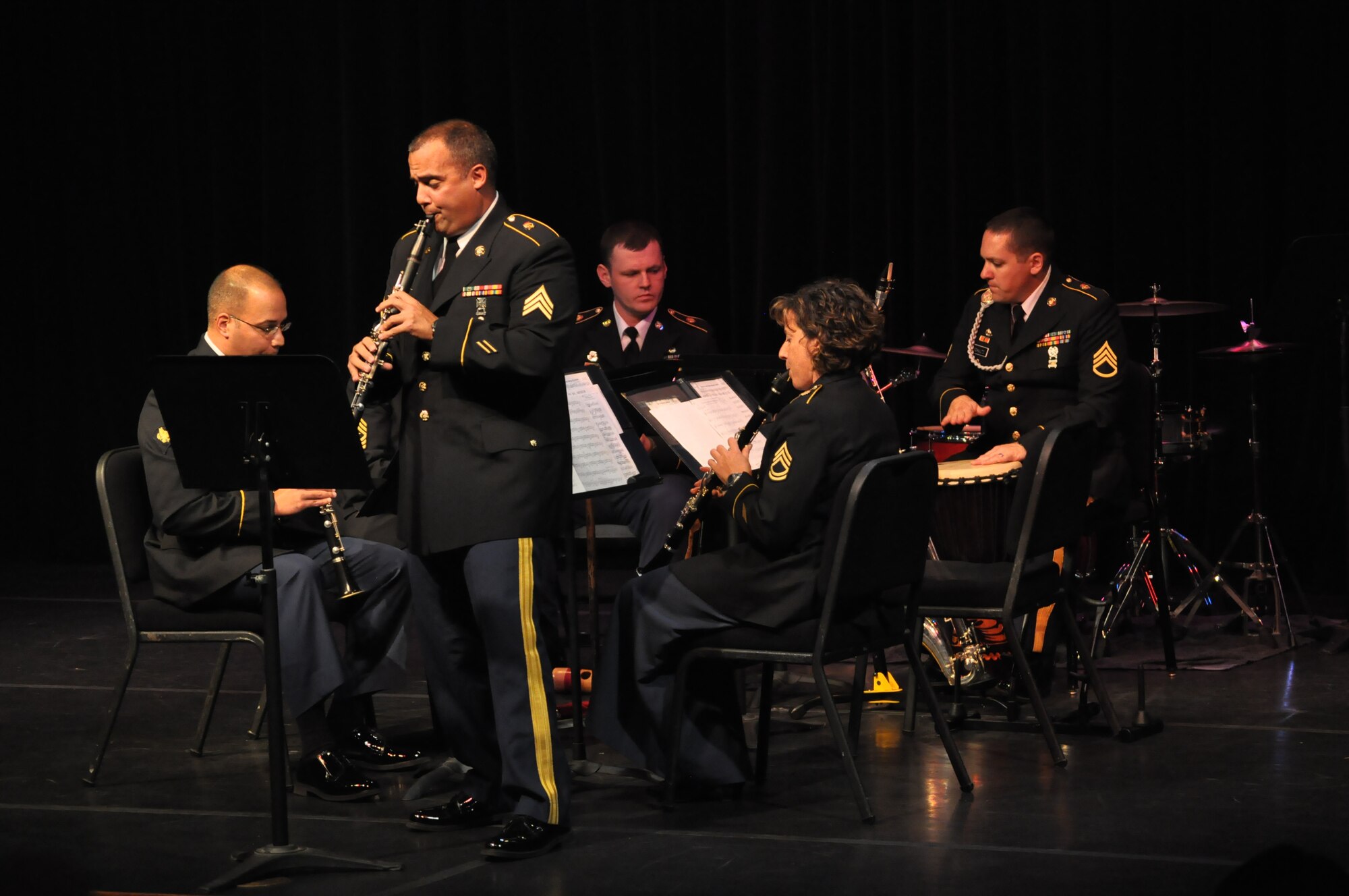 The U.S. Army Training and Doctrine Command Band’s Chamber Music Recital Series recently began with a performance at the Williamsburg Library for an enthusiastic audience of classical music lovers. Sgt. Luis Rivera (standing) TRADOC Band clarinetist and saxophonist, was a soloist with two of the ensembles. 

The chamber music recital featured the TRADOC Band’s Clarinet Quartet, the Woodwind Quintet and the Tuba/Euphonium Quartet.  On Sunday Oct. 21, the TRADOC Band’s Recital Series continues with a performance by the TRADOC Brass Band, TRADOC Transit Authority, performing at the Smithfield Little Theatre at 7pm.  The theater is located at 210 N. Church Street, Smithfield Virginia.

For a lunchtime chamber music treat, at noon Oct. 23rd, the TRADOC Band will perform at St. Bede Catholic Church in Williamsburg.  Featured ensembles include the Woodwind Octet performing selections from Mozart’s Serenade No. 10, conducted by 2nd Lt. Silas Huff, the Flute and Guitar Duo, the Tuba/Euphonium Quartet and the TRADOC Brass Quintet.  As always the TRADOC Band recitals are free and open to the public.  (Courtesy photo / Released)