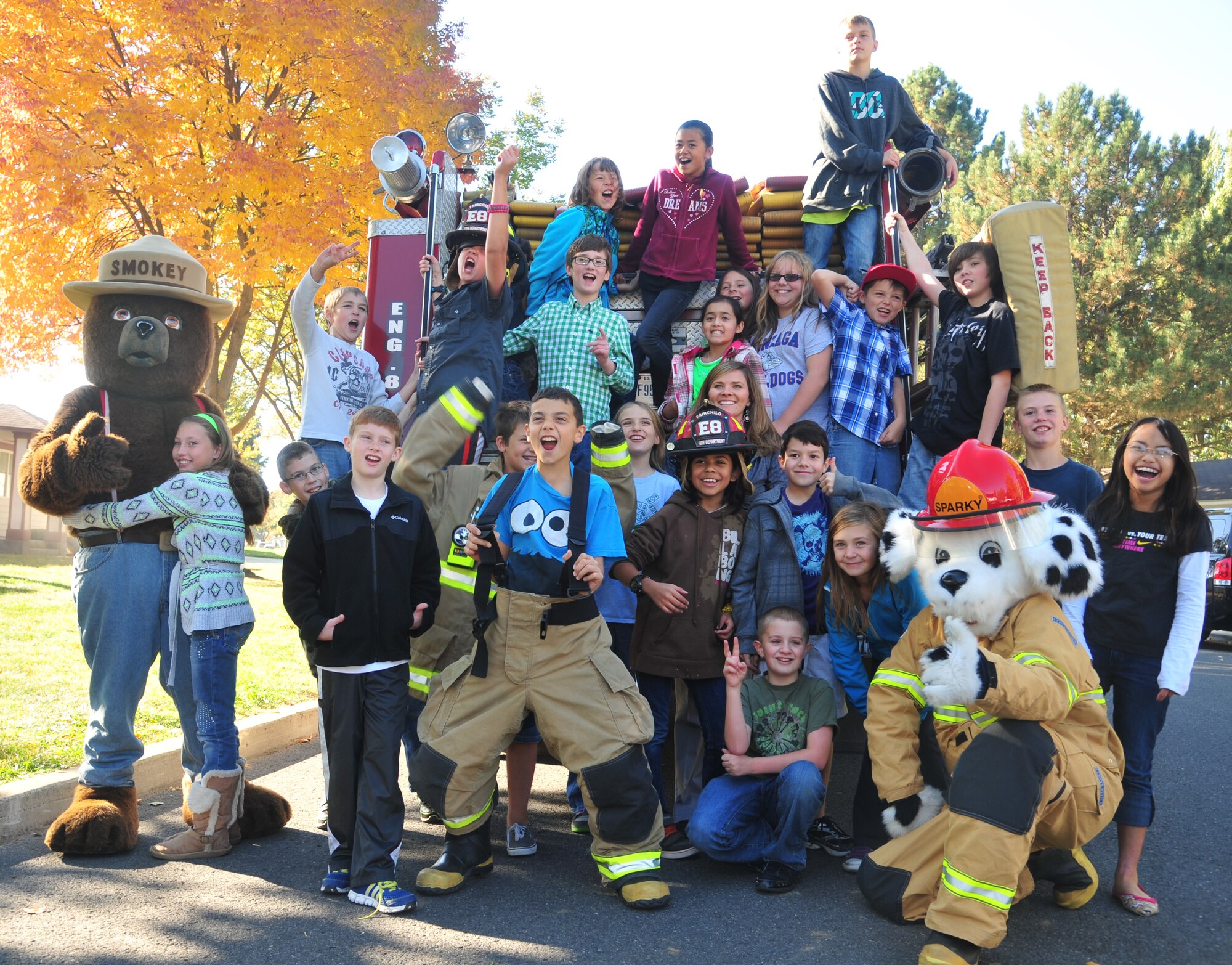 A group of Michael Anderson Elementary School fifth graders scream this year’s fire prevention theme “have two ways out,” meaning know multiple exits from a building in case of a fire. During Fire Prevention Week, fire fighters taught people to be “rabbit ready” as rabbits build their burrows with two ways out so they’ll always be able to escape if they sense danger. Fire fighters from the 92nd Air Refueling Wing hosted Fire Prevention Week from Oct. 8 through Oct. 11. (U.S. Air Force photo by Airman 1st Class Earlandez Young)   