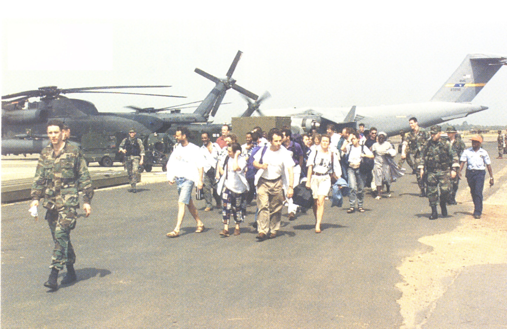 During Operation Assured Response, Special Operations Forces successfully evacuate more than 2,000 people out of the United States Embassy in Liberia, Africa. Operating in a hostile fire environment, SOF personnel conducted dozens of rotary wing evacuation flights using MH-53Js and overhead fire support sorties from AC-130H Spectres, often vectoring friendly aircraft through small arms and rocket propelled grenades. For their efforts, Pave Low crews were presented the Tunner Award as the outstanding strategic airlift crew of the year. (courtesy photo)