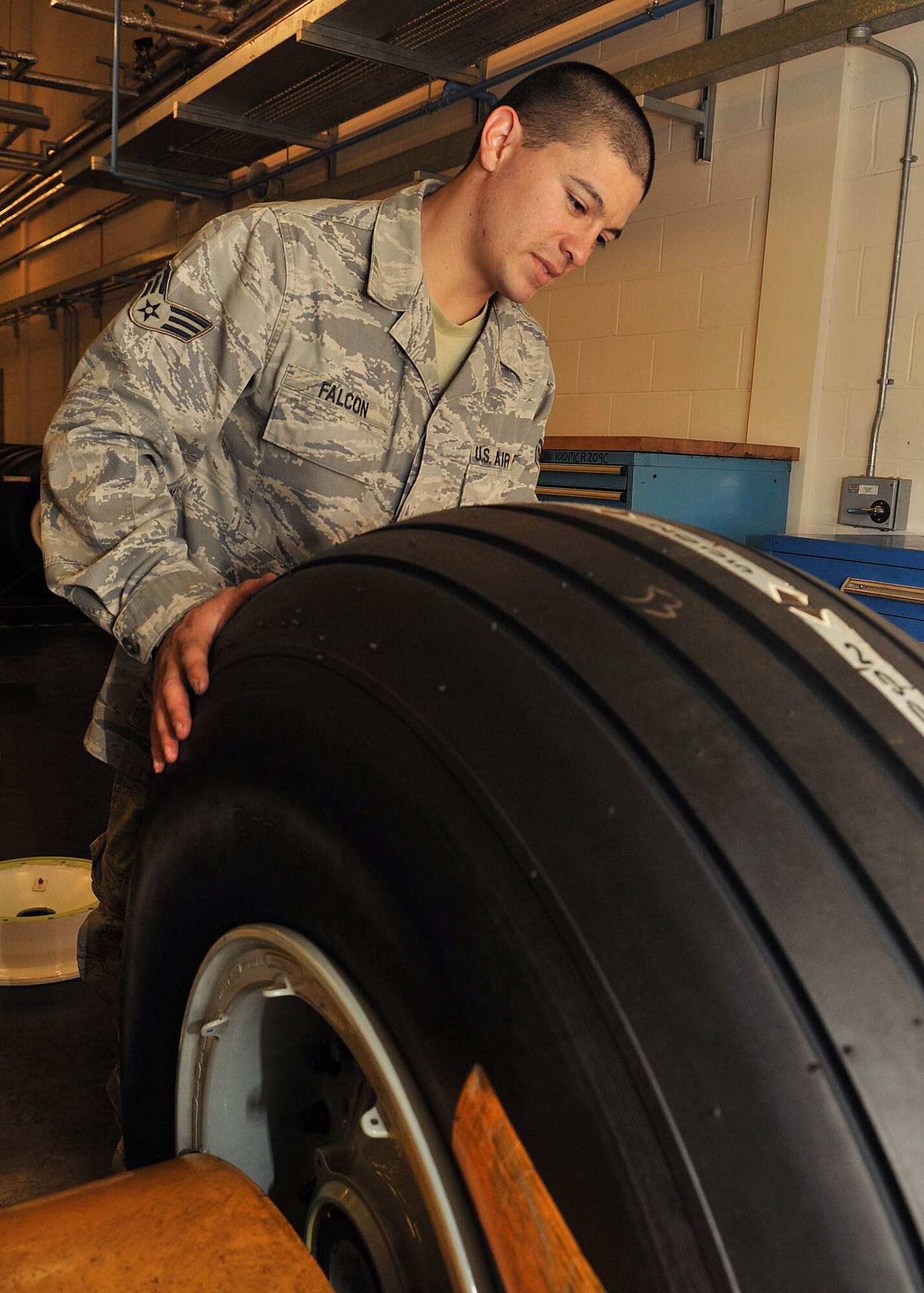 Senior Airman Jacob Falcon, 100th Maintenance Squadron Repair and Reclamation Journeyman, preps a tire for breakdown Oct. 15, 2012, at RAF Mildenhall, England. 