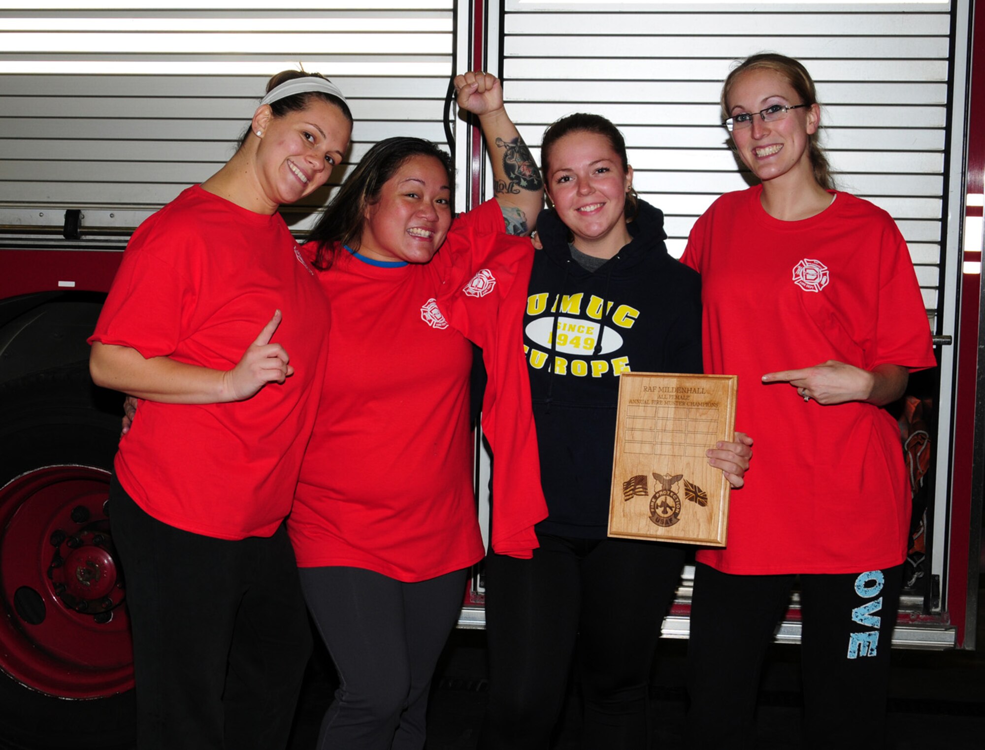The winners of the all-female team, University of Maryland University College, (known as ‘UMUC’) show off their plaque during a fire muster Oct. 11, 2012, at the 100th Civil Engineer Squadron Fire Department, RAF Mildenhall, England. The fire muster was one of several events hosted by the fire department for Fire Prevention Week. (U.S. Air Force photo by Karen Abeyasekere/Released)