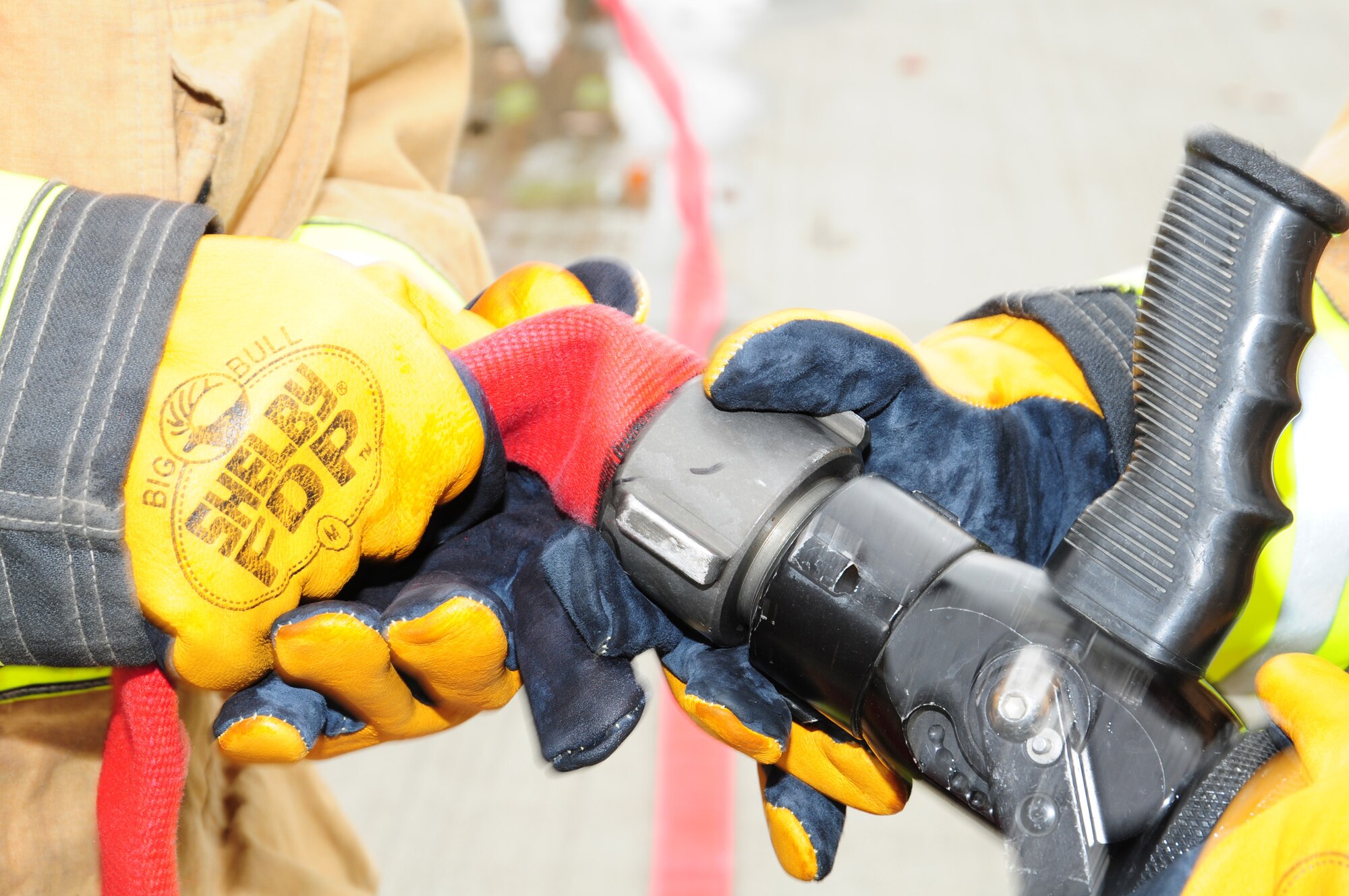 Competitors connect a hose during the fire muster events Oct. 11, 2012, at the 100th Civil Engineer Squadron Fire Department at RAF Mildenhall, England. Six teams competed in the fire muster, which was one of several events organized by the fire department for Fire Prevention Week. The 100th Force Support Squadron  ‘UMUC’ team won first place in the all-female category. The 100th Security Forces Squadron, ‘Raptor 56’ team won first place in the men’s category. (U.S. Air Force photo by Karen Abeyasekere/Released)