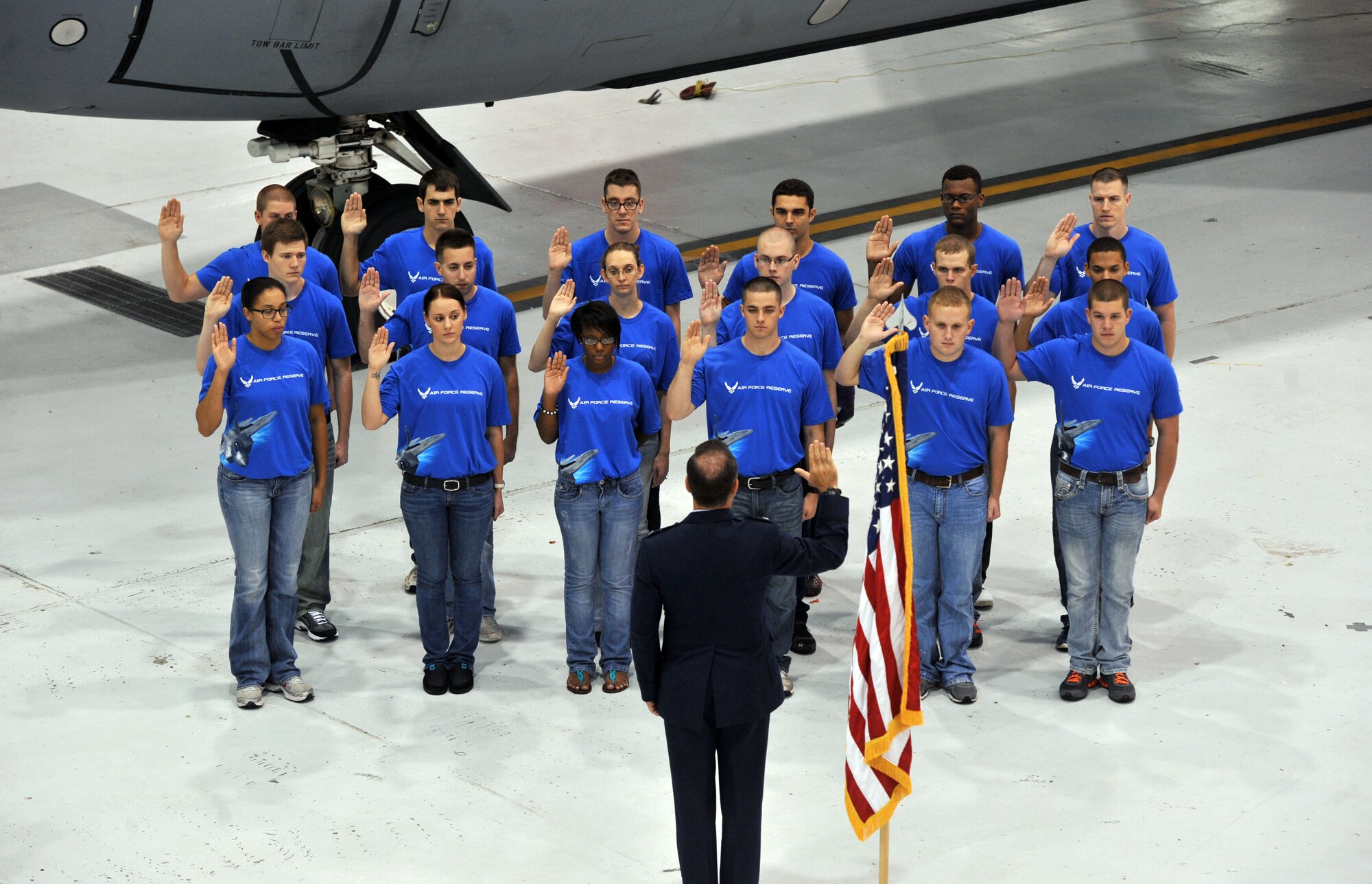 Col. Mark S. Larson, commander, 931st Air Refueling Group, administers the oath of enlistment to 18 new recruits during a mass enlistment ceremony conducted at McConnell Air Force Base, Kan., Oct. 13, 2012.  The mass enlistment ceremony was part of the Air Force Reserve Recruiting Command's annual "Coast-to-Coast Mass Enlistment Ceremony" event.  (U.S. Air Force photo by Airman 1st Class Maurice A. Hodges)