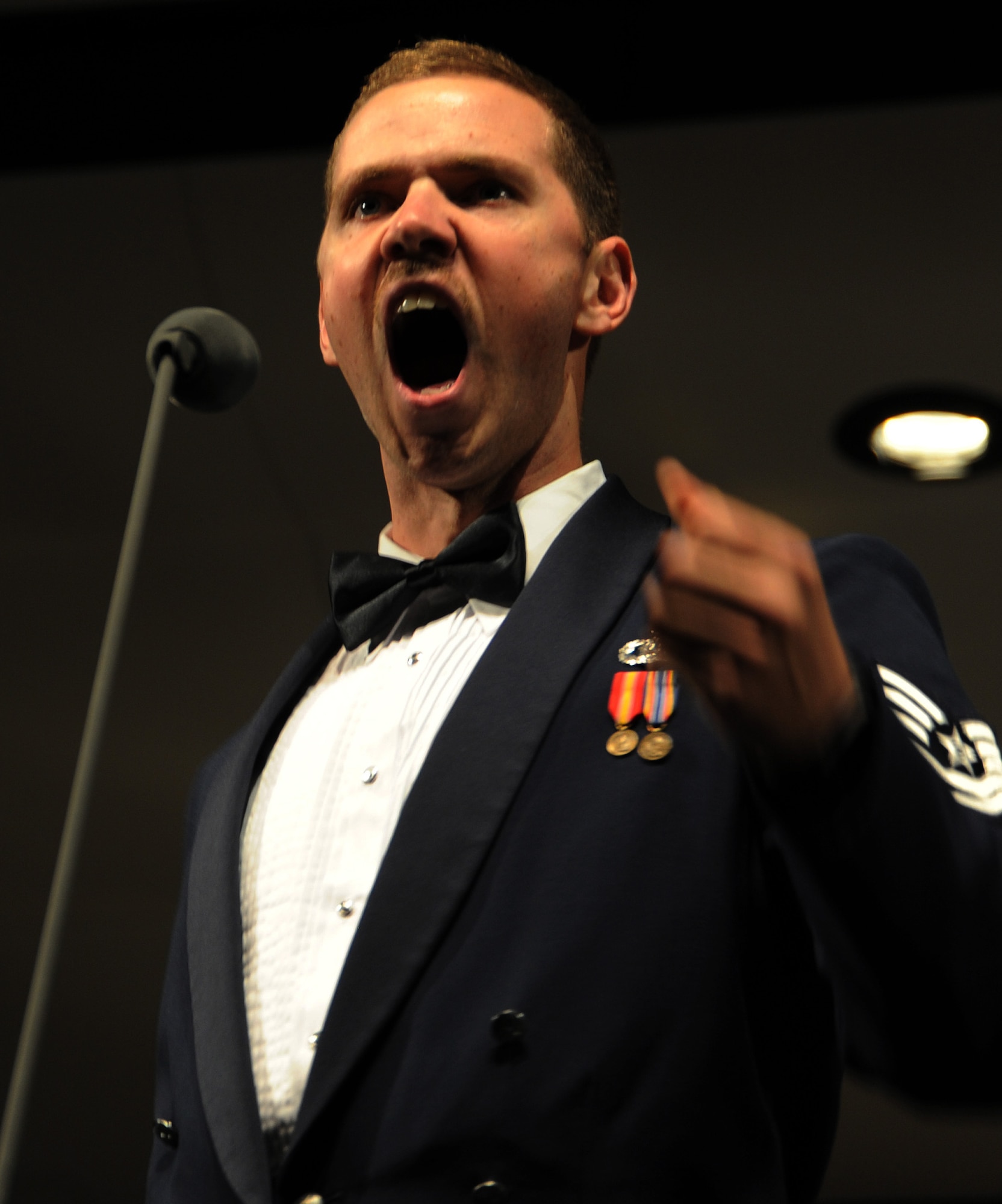 Tech. Sgt. Daniel Anderson, U.S. Air Force Band, Singing Sergeant, performs "Funiculi, Funicula" during a concert at the Reed L. Buffington Visual & Performing Arts Center, Hayward in Calif., Oct. 12. The concert was the first of the 2012 Fall Tour in which the band will perform in 14 different cities in 14 nights. The Singing Sergeants is one of the most versatile and travelled choral organizations in the world. (U.S. Air Force photo/ Staff Sgt. Keyonna Fennell) 