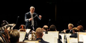 Col. Larry Lang, United States Air Force Band, commander and conductor, leads the group as they perform a musical number at Chabot College in Hayward, Caif., Oct 12. The Air Force band travelled to Hayward as part of their 2012 fall tour. (U.S. Air Force photo/ Staff Sgt. Keyonna Fennell)