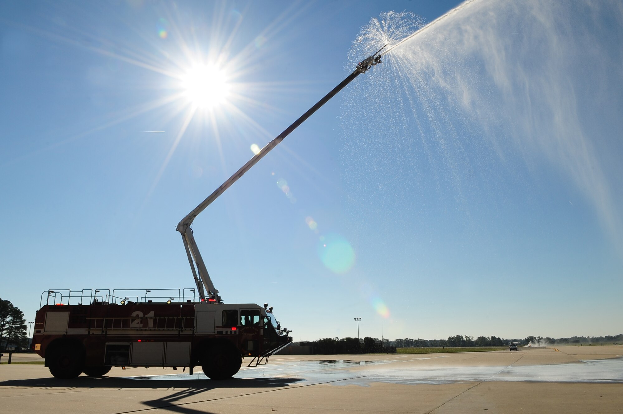A fire truck from the 4th Civil Engineer Squadron sprays water during a demonstration for Fire Prevention Week on Seymour Johnson Air Force Base, N.C., Oct. 11, 2012. U.S. Air Force Airmen assigned to the 4th CES Fire Department hosted several fire prevention events promoting this year’s motto, “Have two ways out,” throughout the week. (U.S. Air Force photo/Airman 1st Class Aubrey White/Released)