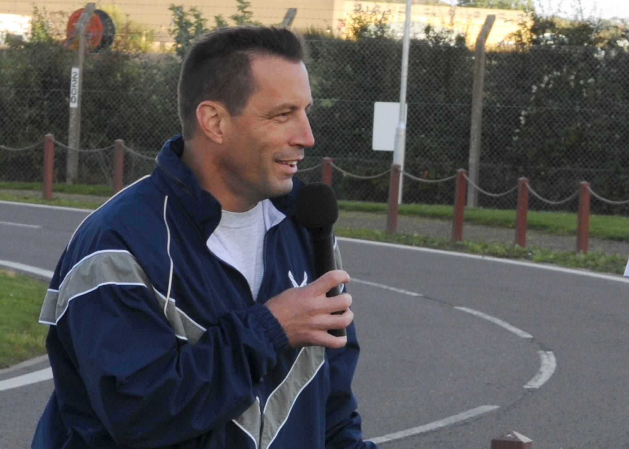 Col. Christopher Kulas, 100th Air Refueling Wing commander, reminds base members to be conscious of fire safety as part of Fire Prevention Week before the wing run Oct. 12, 2012, at RAF Mildenhall, England. The monthly 5K run encourages morale and camaraderie through exercise and healthy competition.  (U.S. Air Force photo by Staff Sgt. Tabitha Lee/Released)