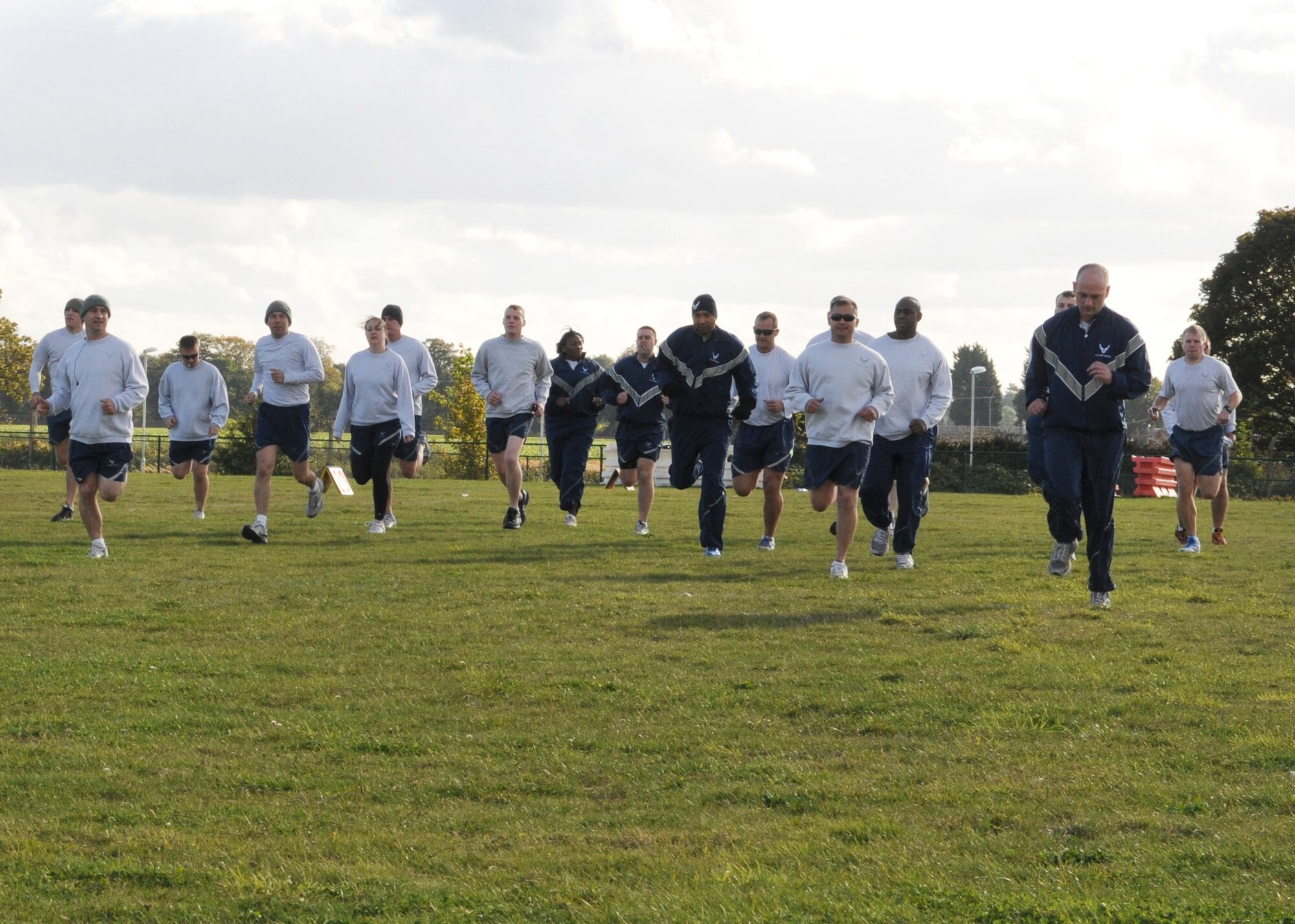 Members of the 488th Intelligence Squadron warm up before the wing run Oct. 12, 2012, at RAF Mildenhall, England.  The monthly 5K run brings together the many units on base through exercise and healthy competition.  (U.S. Air Force photo by Staff Sgt. Tabitha Lee/Released)