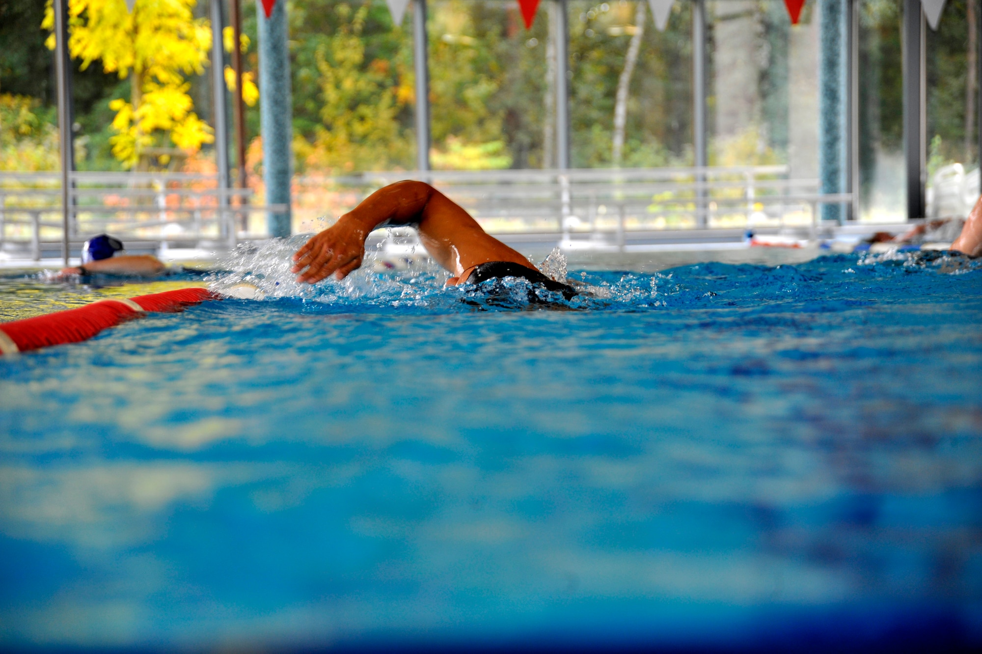 Chris Cole, member of the 319th Recruiting Squadron delayed entry program, swims free style during a 500-meter swim test at the Ramstein Aquatic Center, Ramstein Air Base, Germany, Oct. 11, 2012. Cole is scheduled to leave for basic training Oct. 17 and, upon graduation, is slated for combat controller training. (U.S. Air Force photo/Senior Airman Katherine Holt)