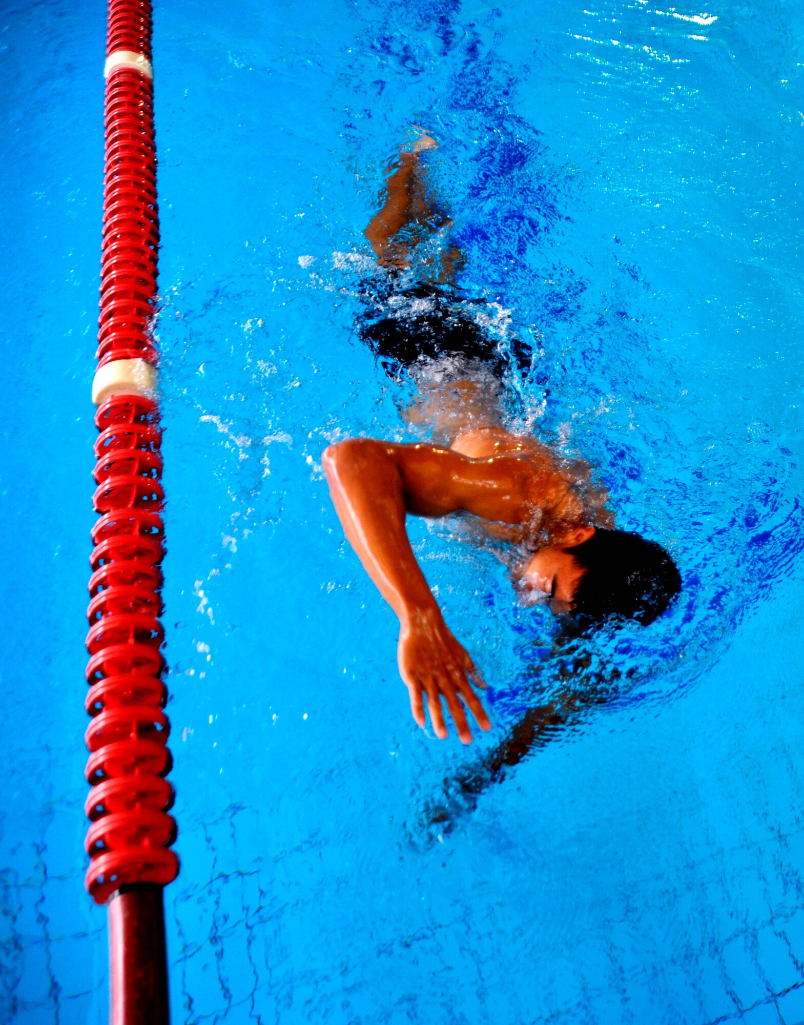 Chris Cole, member of the 319th Recruiting Squadron delayed entry program, swims free style during a 500-meter swim test at the Ramstein Aquatic Center, Ramstein Air Base, Germany, Oct. 11, 2012. Cole is scheduled to leave for basic training Oct. 17 and, upon graduation, is slated for combat controller training. (U.S. Air Force photo/Senior Airman Katherine Holt)