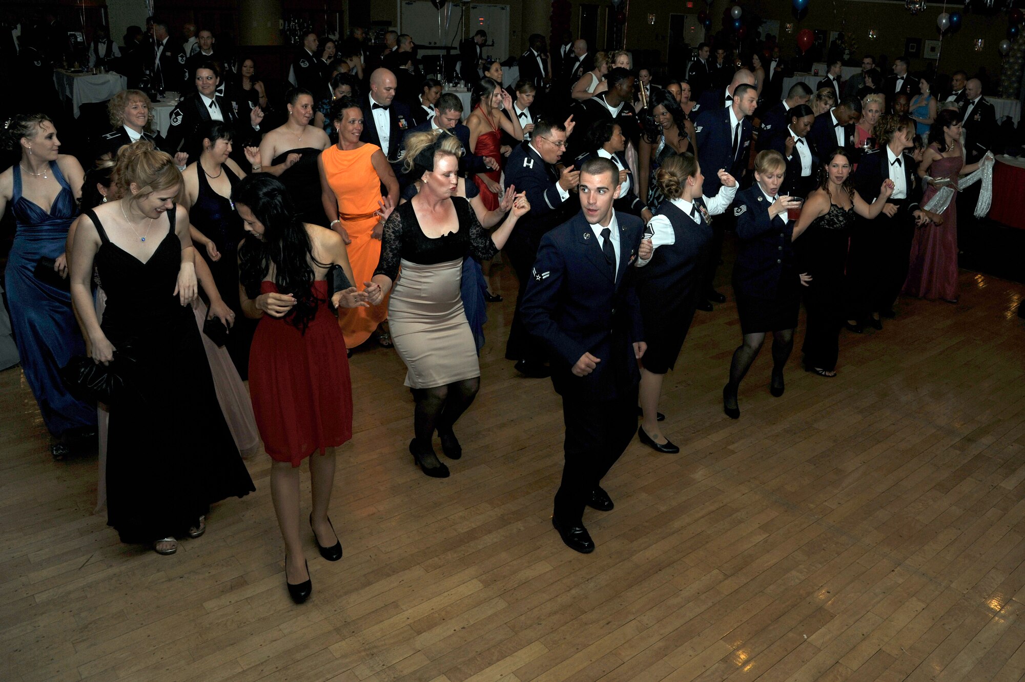 Attendees enjoy a night of fun as they take to the dance floor during the 65th Annual Air Force Ball celebration at Misawa Air Base, Japan, Oct. 13, 2012.  More than 300 people came out to help celebrate 65 years of airpower. This year's theme was a tradition of honor and legacy of valor. (U.S. Air Force photo by Tech. Sgt. Marie Brown)