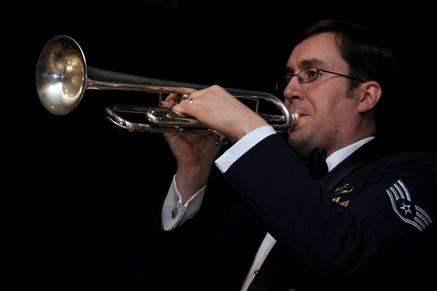 A member of the U.S. Air Force Band of the Pacific-Asia plays the trumpet during the 65th Annual Air Force Ball celebration at Misawa Air Base, Japan, Oct. 13, 2012. This year's theme focused on Air Force history, a tradition of honor and legacy of valor. (U.S. Air Force photo by Tech. Sgt. Marie Brown)