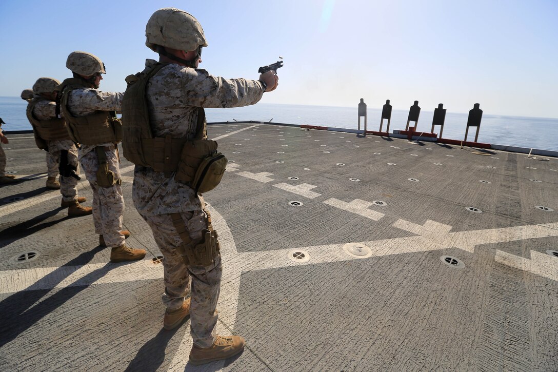 USS GUNSTON HALL, Gulf of Oman (Oct. 5, 2012) - Marines with Combat Logistics Battalion 24, 24th Marine Expeditionary Unit, fire M-9 Beretta pistols during sustainment training on the flight deck of the USS Gunston Hall in the Gulf of Oman, Oct. 5, 2012. The 24th MEU is deployed with the Iwo Jima Amphibious Ready Group as a theater reserve and crisis response force for U.S. Central Command in the U.S. Navy's 5th Fleet area of responsibility. 