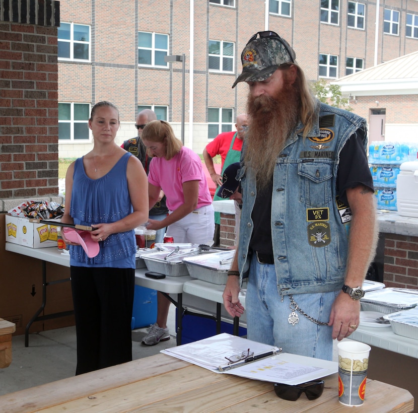 H. T. Huchi, commander for North Carolina Combat Veteran Motorcycle Association 15-4 otherwise known as Hooch, reads a list of sponsors who contributed to the barbecue held at Wounded Warriors Battalion Barracks aboard Marine Corps Base Camp Lejeune Oct. 4.