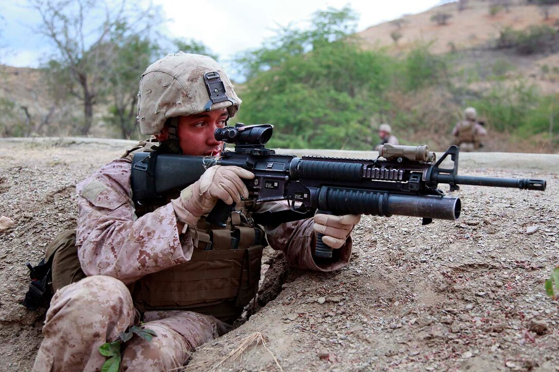 Lance Cpl. Daniel Fiaseu, team leader, 1st Fire Team, 2nd Squad, 3rd Platoon, India Company, Battalion Landing Team 3/5, 15th Marine Expeditionary Unit, provides security during a patrol after the unit arrived in Timor-Leste for Exercise Crocodilo 2012, Oct. 11. Crocodilo12 serves as the first exercise scheduled during the MEU's deployment that began on Sept. 17. Throughout the exercise, forces will participate in various events to include field exercises and community relations activities aimed at strengthening the relationship between the US and Timor-Leste. The 15th MEU is currently embarked as part of the Peleliu Amphibious Ready Group, while they serve as the nation's rapid-response sea-based Marine Air Ground Task Force for Western Pacific Deployment 12-02. Fiaseu, 21, is from Albuquerque, N.M.