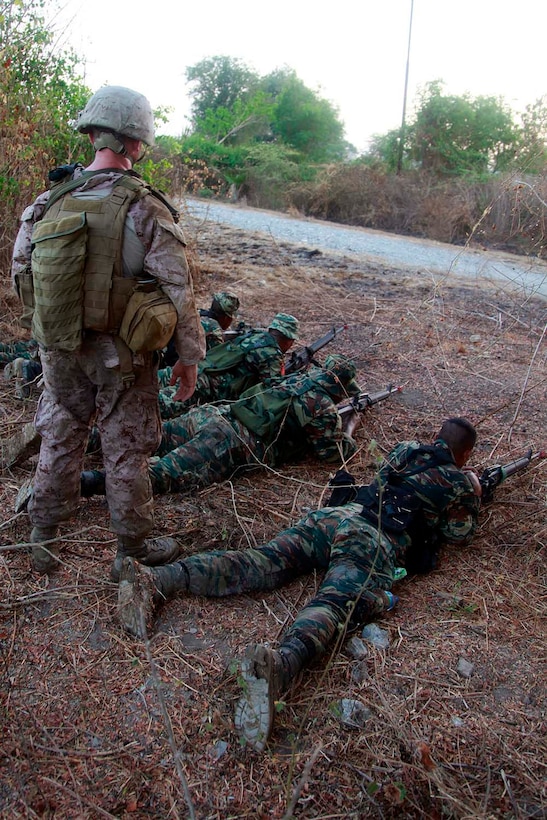 Sergeant Troy J. Hauck, squad leader, 2nd Squad, 2nd Platoon, India Company, Battalion Landing Team 3/5, 15th Marine Expeditionary Unit, observes the Timor- Leste Defense Force during a raid, as part of Exercise Crocodilo 2012, Oct. 13. Crocodilo12 serves as the first exercise scheduled during the MEU's deployment that began on Sept. 17. Throughout the exercise, forces will participate in various events to include field exercises and community relations activities aimed at strengthening the relationship between the US and Timor-Leste. The 15th MEU is currently embarked as part of the Peleliu Amphibious Ready Group, while they serve as the nation's rapid-response sea-based Marine Air Ground Task Force for Western Pacific Deployment 12-02. Hauck, 23, is from Manhattan, Kansas.