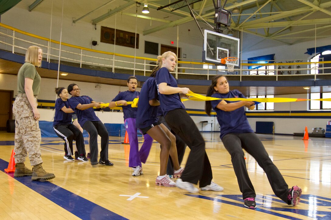 Female poolees participate in the Tug o' War portion of the all-female pool function Oct. 13. Recruiting Station Milwaukee holds quarterly pool functions specifically for its female poolees in order to prepare them for the rigors of recruit training.