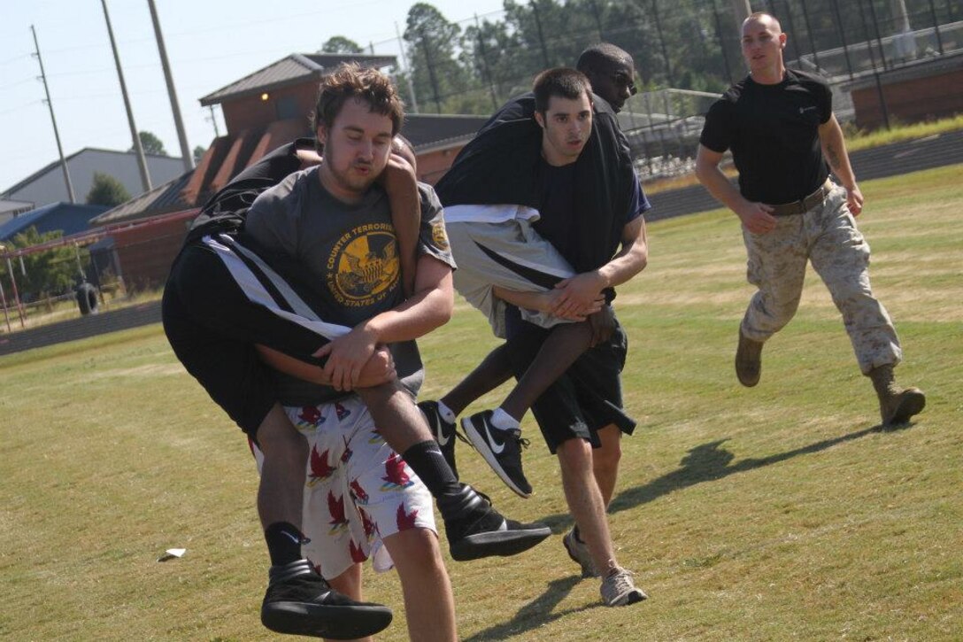 The future Marines of Recruiting Substations Columbia and Lexington, Recruiting Station Columbia, negotiate the Combat Fitness Challenge Oct. 13 at White Knoll High School in Lexington, S.C. The event tested the enlistees’ mental and physical fitness in preparation for Marine Corps Recruit Training. (Marine Corps photo by Sgt. Aaron Rooks)
