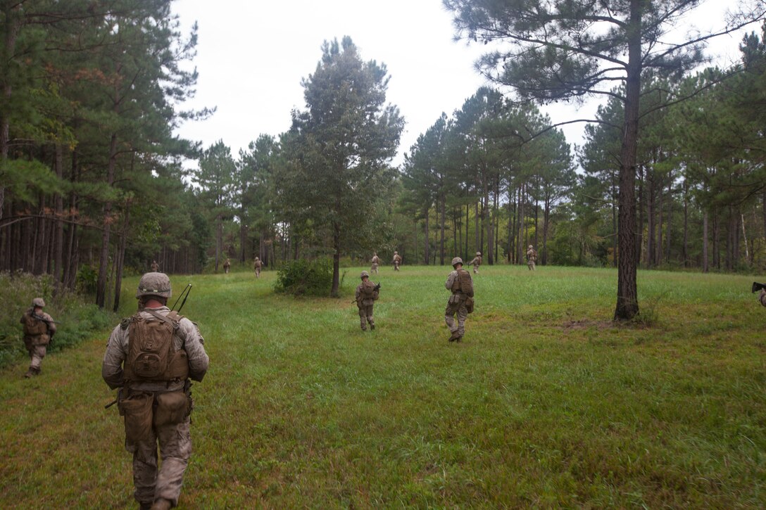 Marines assigned to Battalion Landing Team (BLT) 3/2, 26th Marine Expeditionary Unit (MEU), move to their objective area at Fort Pickett, Va., Sept. 16, 2012. BLT 3/2 conducted an infantry platoon battle course working in a coordinated effort involving mortars, machine guns, and rifles to engage, and suppress an enemy while isolating a seizing an objective. This training is part of the 26th MEU's pre-deployment training program. BLT 3/2 is one of the three reinforcements of 26th MEU, which is slated to deploy in 2013.