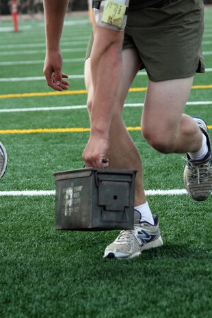 Recruits perform ammunition can lifts as part of a dynamic exercise during ability groups Oct. 11 aboard Marine Corps Recruit Depot San Diego. This exercise helps recruits build their strength, balance and coordination.