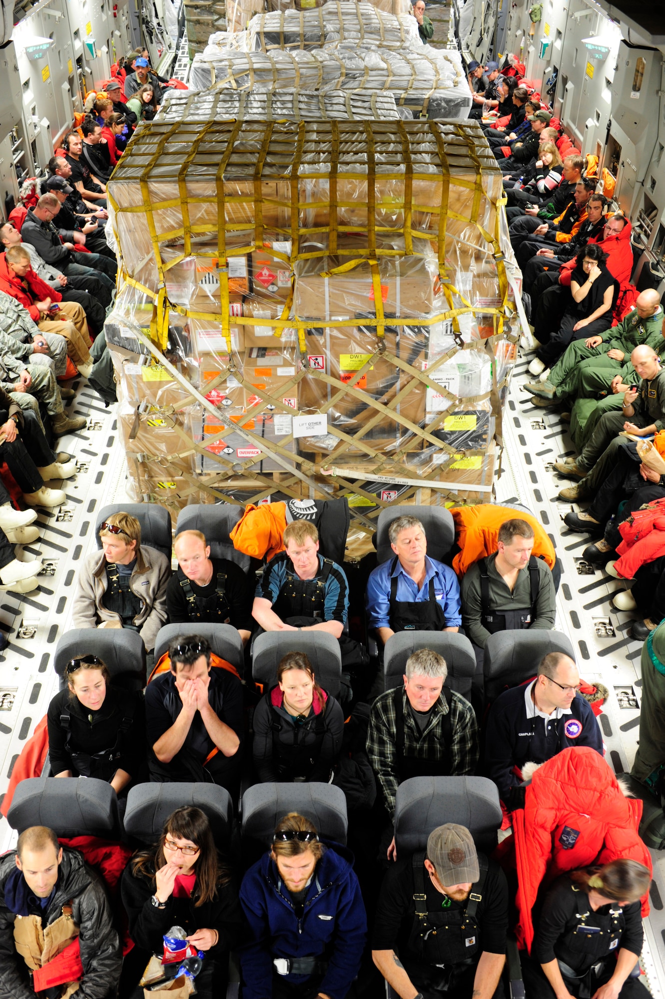 National Science Foundation personnel sit aboard a C-17 Globemaster III aircraft, deployed from Joint Base Lewis-McChord, Wash., Oct. 1, 2012. The aircraft, which departed Christchurch, New Zealand, delivered 76 NSF personnel and 64,000 pounds of cargo to McMurdo Station, Antarctica in support of Operation Deep freeze. (U.S. Air Force photo/Staff Sgt. Sean Tobin)