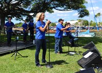 Master Sgt. Lara Murdzia, Tech. Sgt. Richard Vasquez and Tech. Sgt. Tamiko Boone, members of the U.S. Air Force Band of the Pacific-Hawaii group “Hana Hou,” sing during the Mahalo Bash, at Joint Base Pearl Harbor-Hickam, Oct. 12, 2012. The Mahalo Bash is an annual event hosted by the Pacific Air Forces commander to thank Airmen and their families for their service and hard work throughout the year. (U.S. Air Force photo/Tech. Sgt. Jerome S. Tayborn)