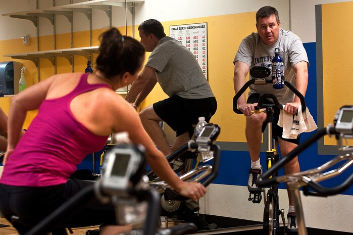 Kent Terrillion, 99th Aerospace Medical Squadron Health and Wellness Center fitness program manager, conducts a spin class at the HAWC Oct. 15, 2012, at Nellis Air Force Base, Nev. Spin classes offer participants a more intense cardio instructed workout with a low impact.(U.S. Air Force photo by Staff Sgt. Christopher Hubenthal)